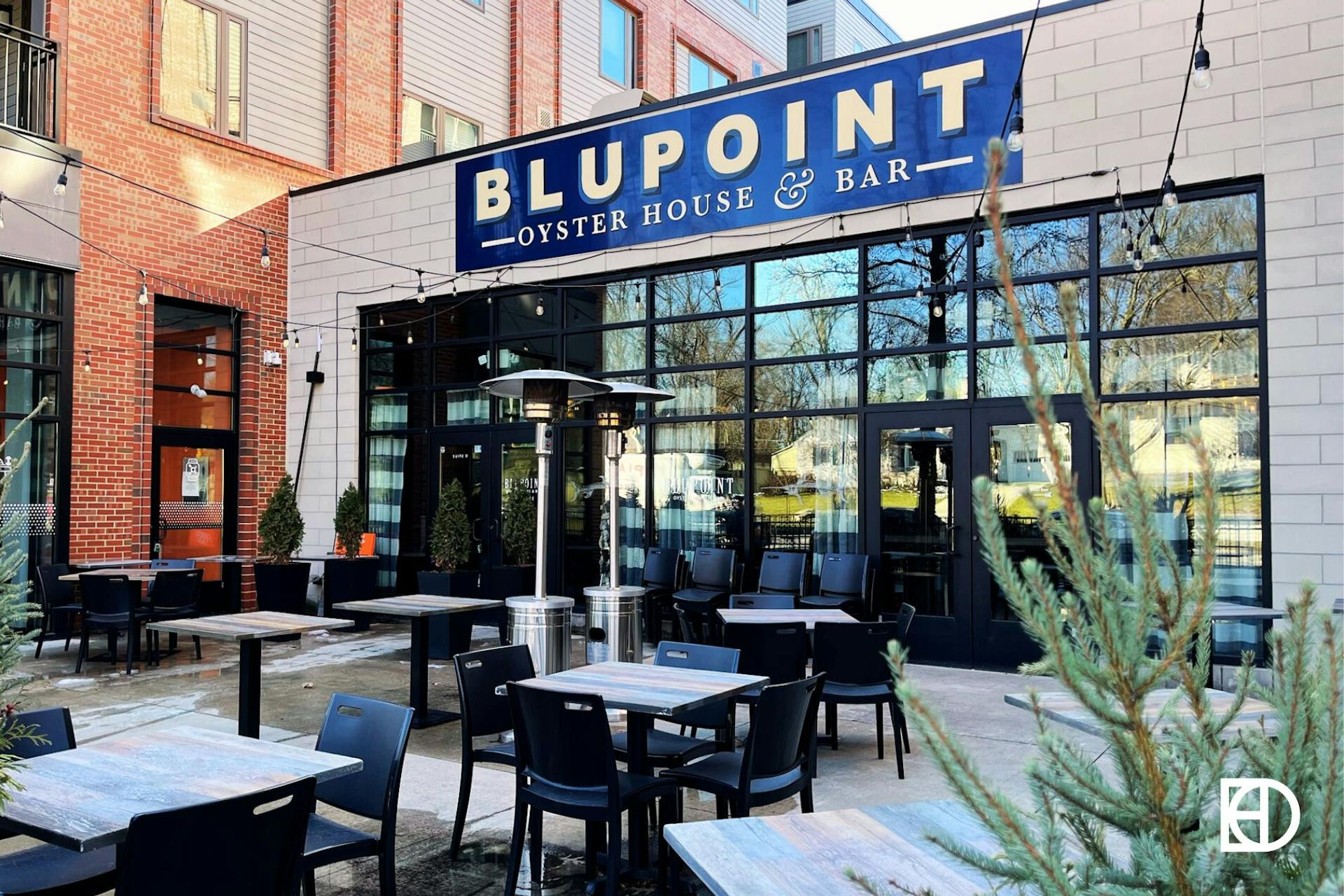 Exterior photo of Blupoint Coastal Kitchen, showing signage and patio