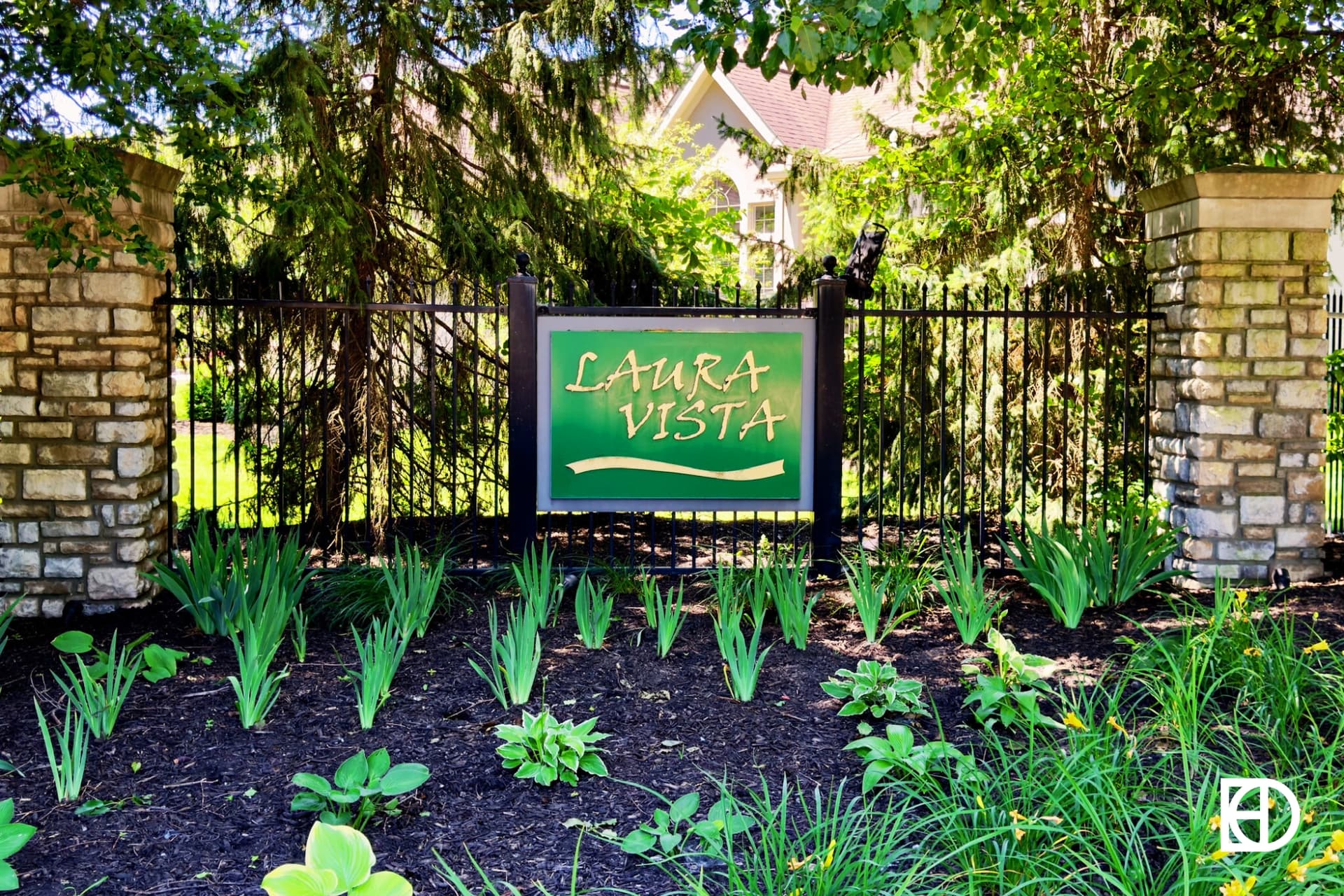 Exterior photo of Laura Vista, showing signage and landscaping