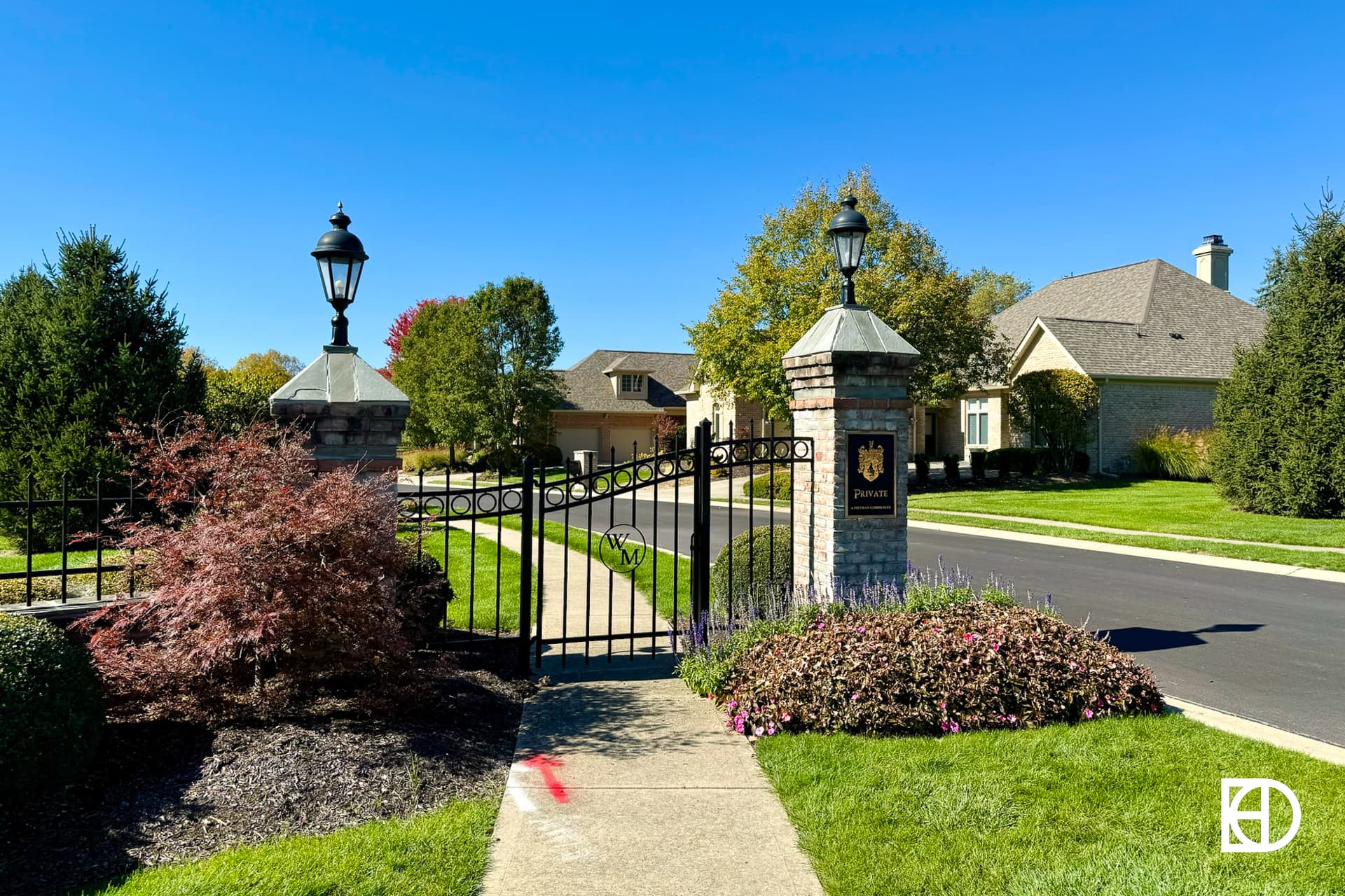 Exterior photo of Williams Mill, showing entrance gate and landscaping
