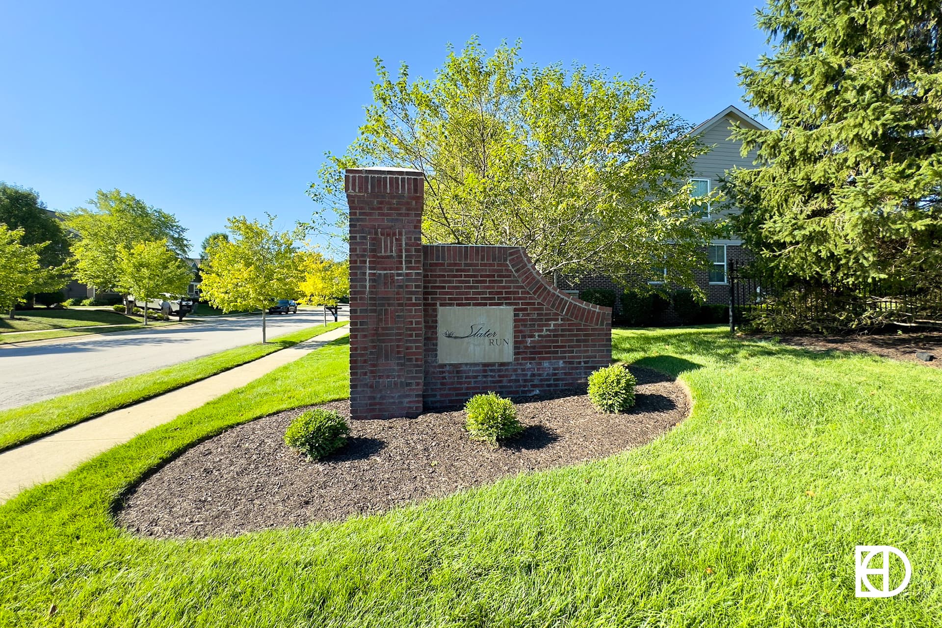 Brick and stone entrance sign for Slater Run of Noblesville.