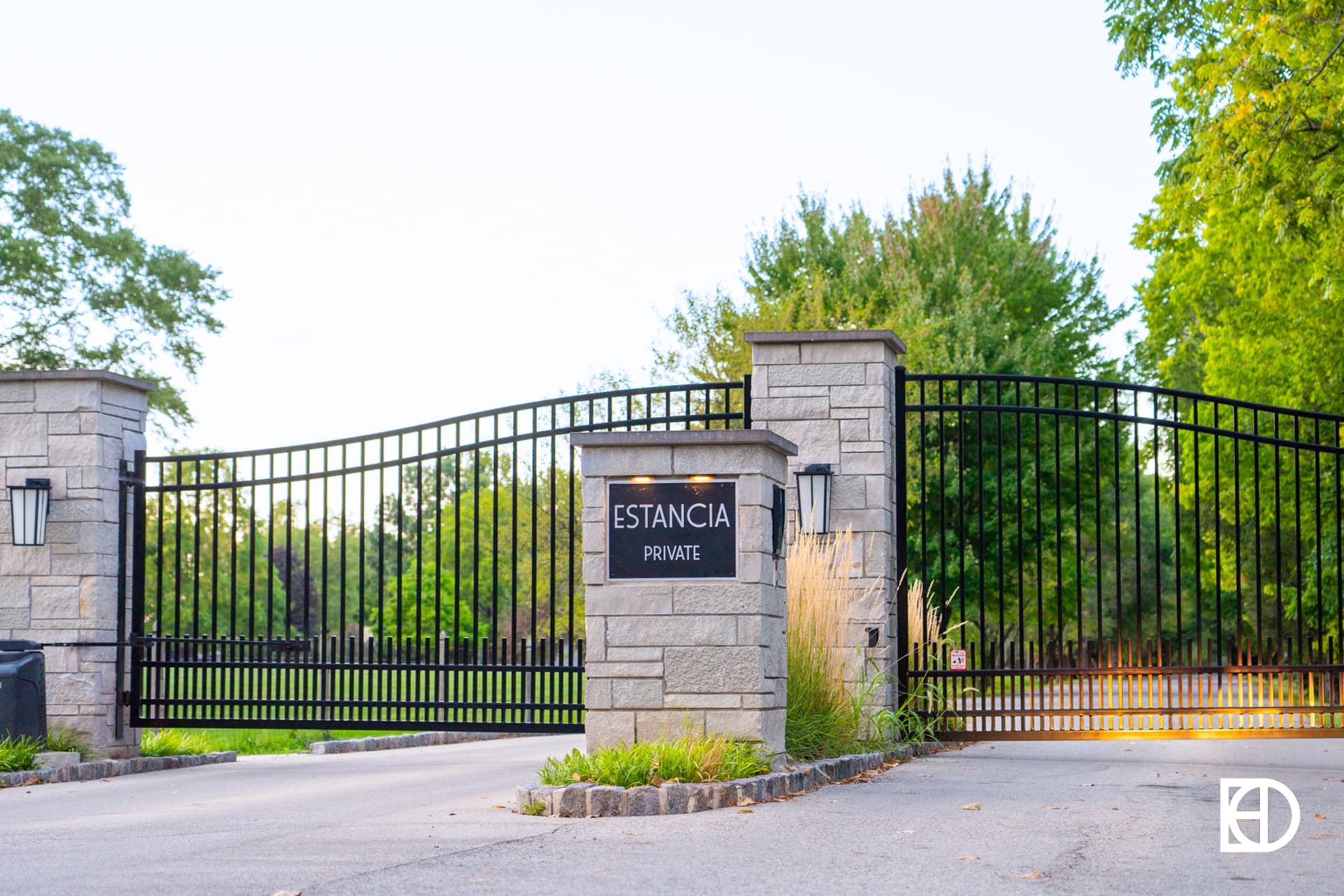 Photo of entrance to Estancia Way, showing signage and landscaping