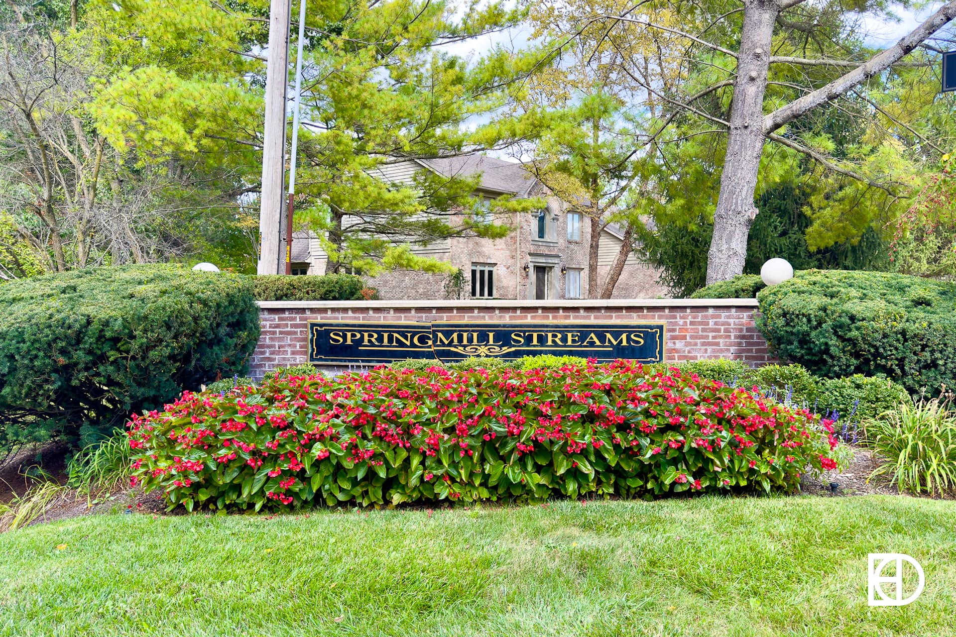 Exterior photo of Springmill Streams, showing signage and landscaping