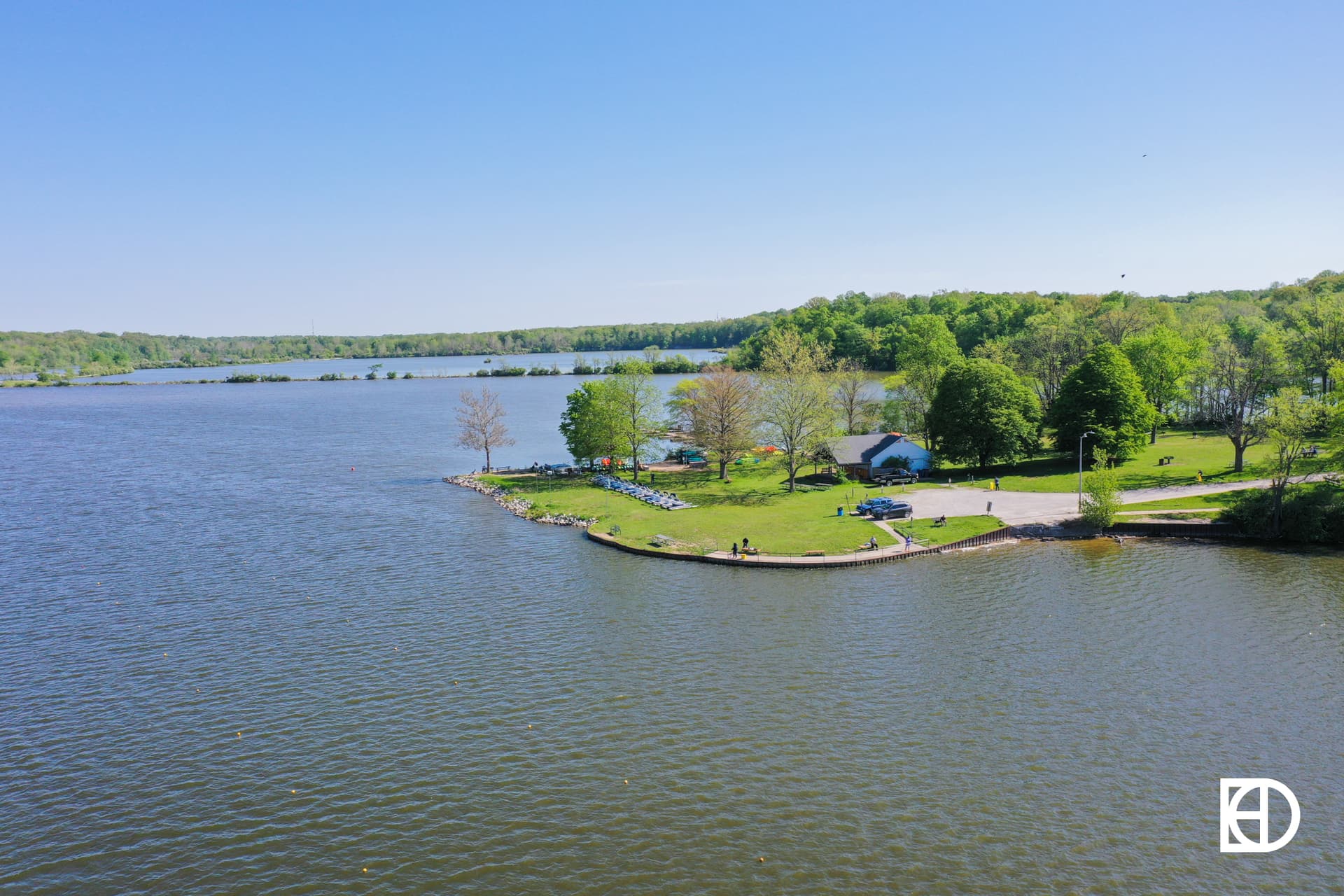 Exterior photo of Eagle Creek Park, showing lake, greenspace, and trees
