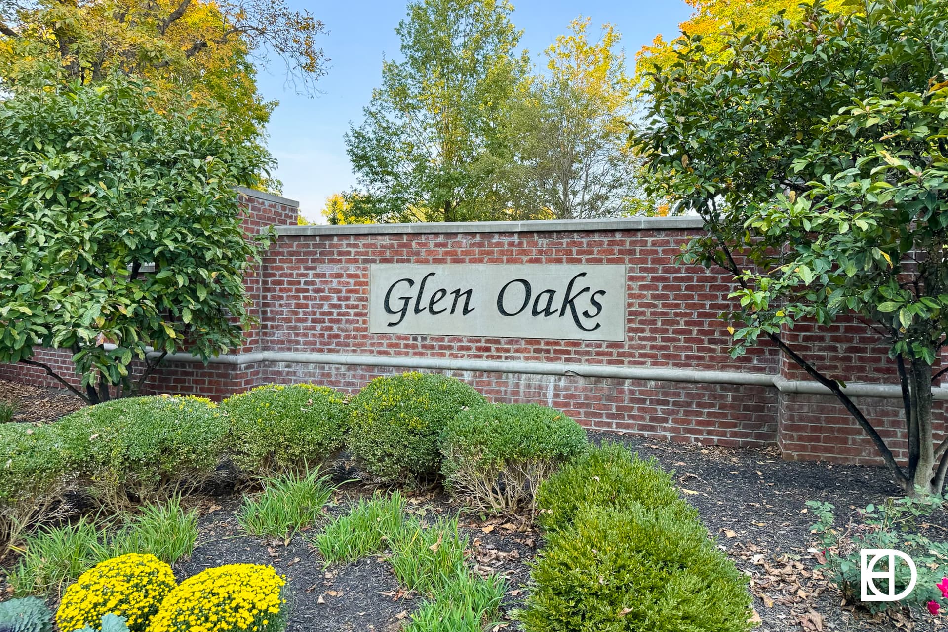 Exterior photo of Glen Oaks, showing signage and landscaping