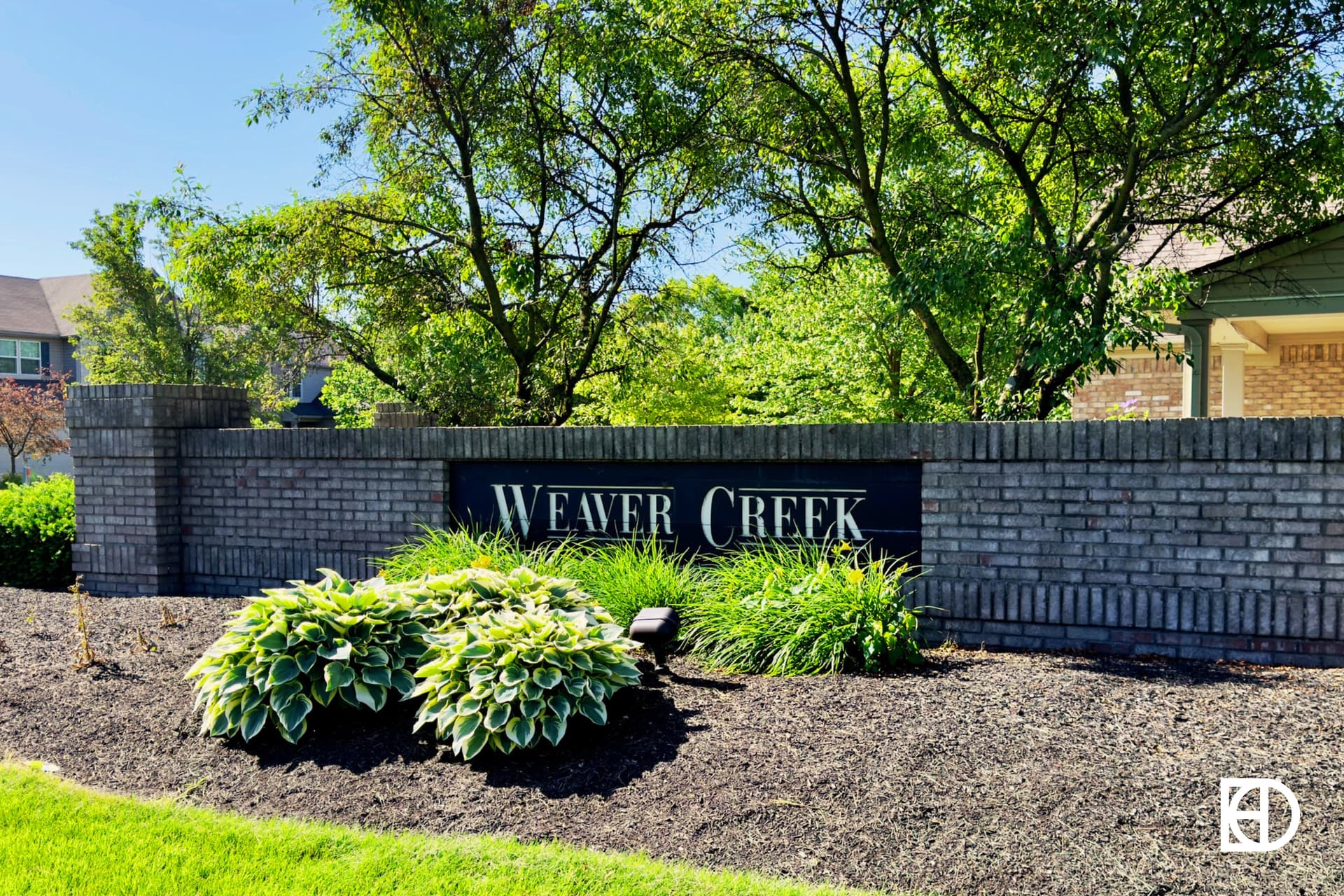 Exterior photo of Weaver Creek, showing signage and landscaping