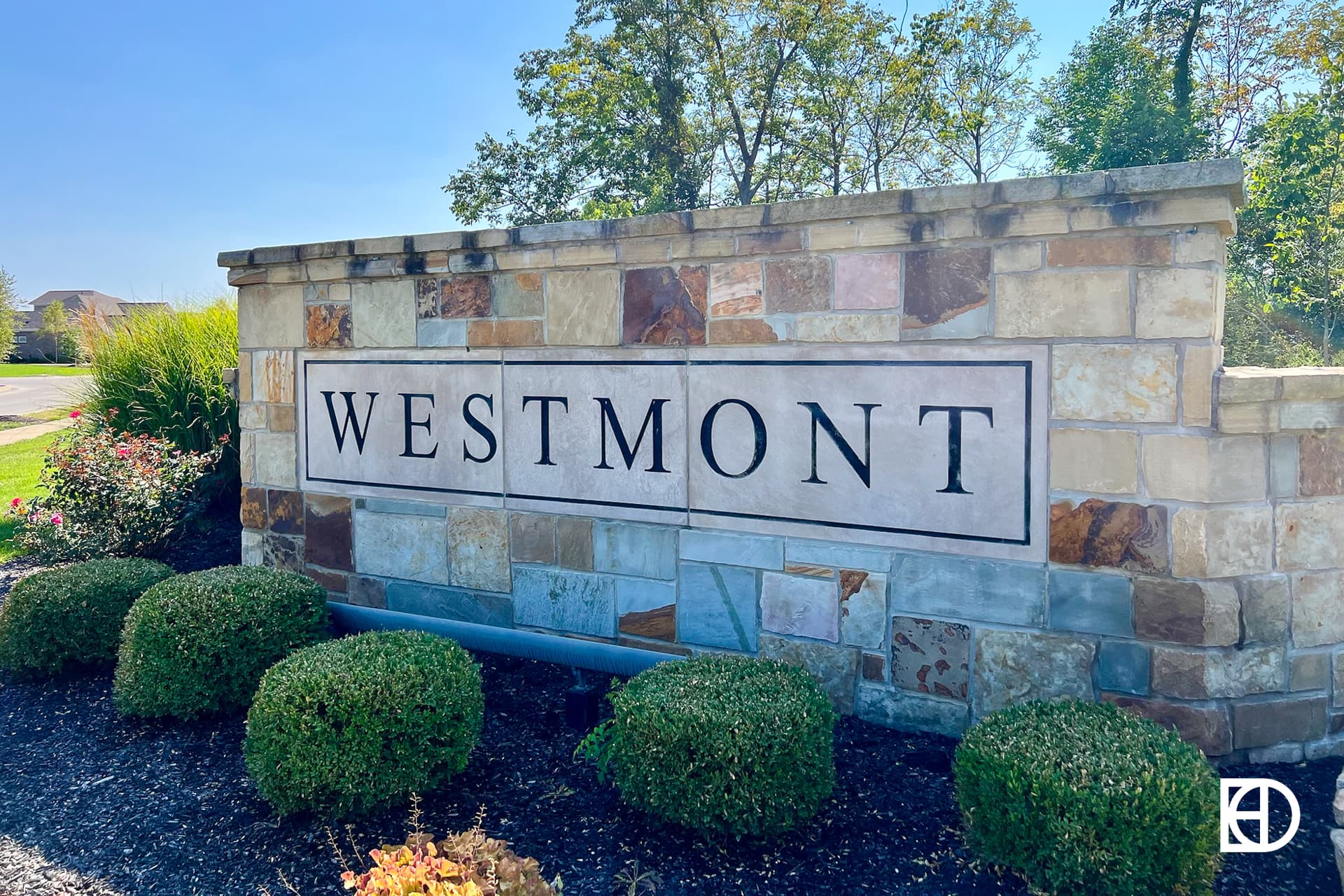 Exterior photo of Westmont, showing signage and landscaping