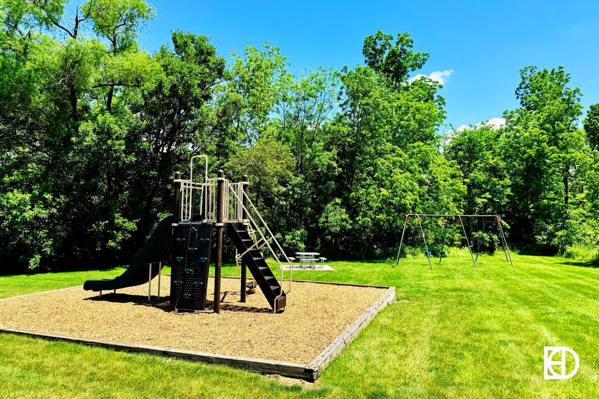 Exterior photo of West Harbour, showing playground and landscaping