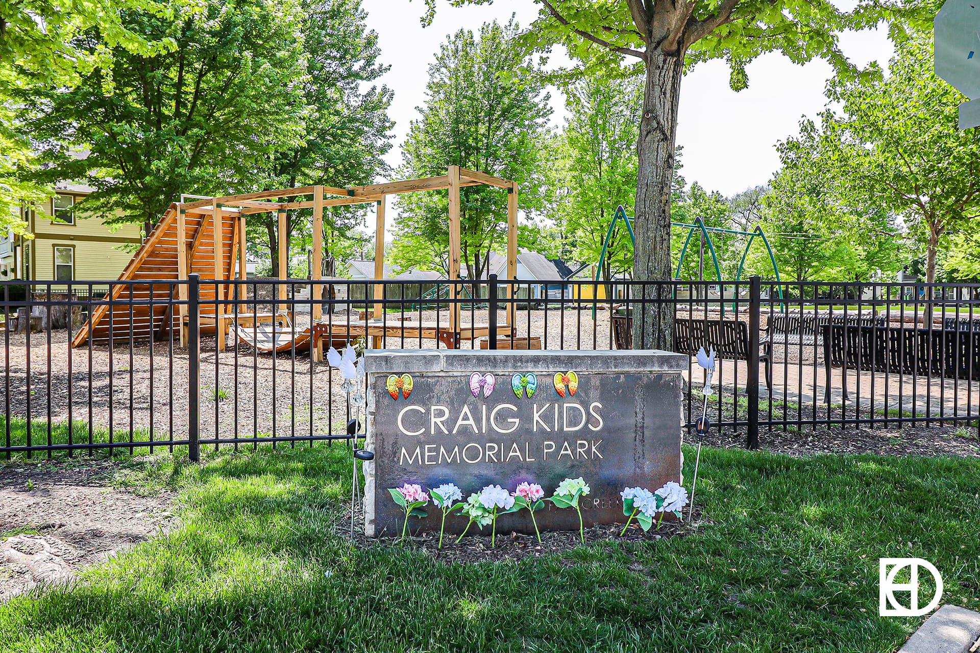 Exterior photo of Craig Kids Memorial Park, showing playground and signage