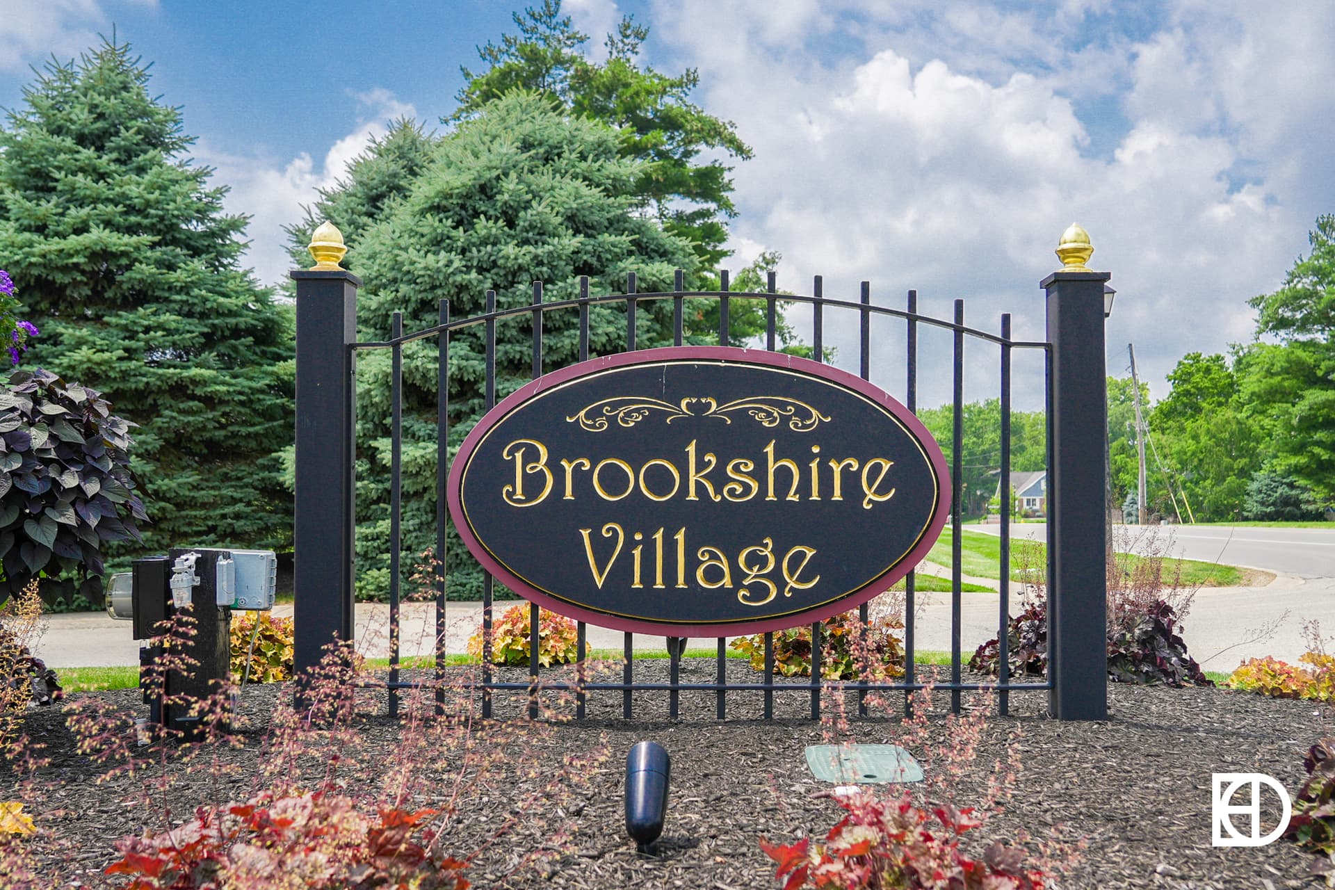 Exterior photo of Brookshire Village, showing signage and landscaping