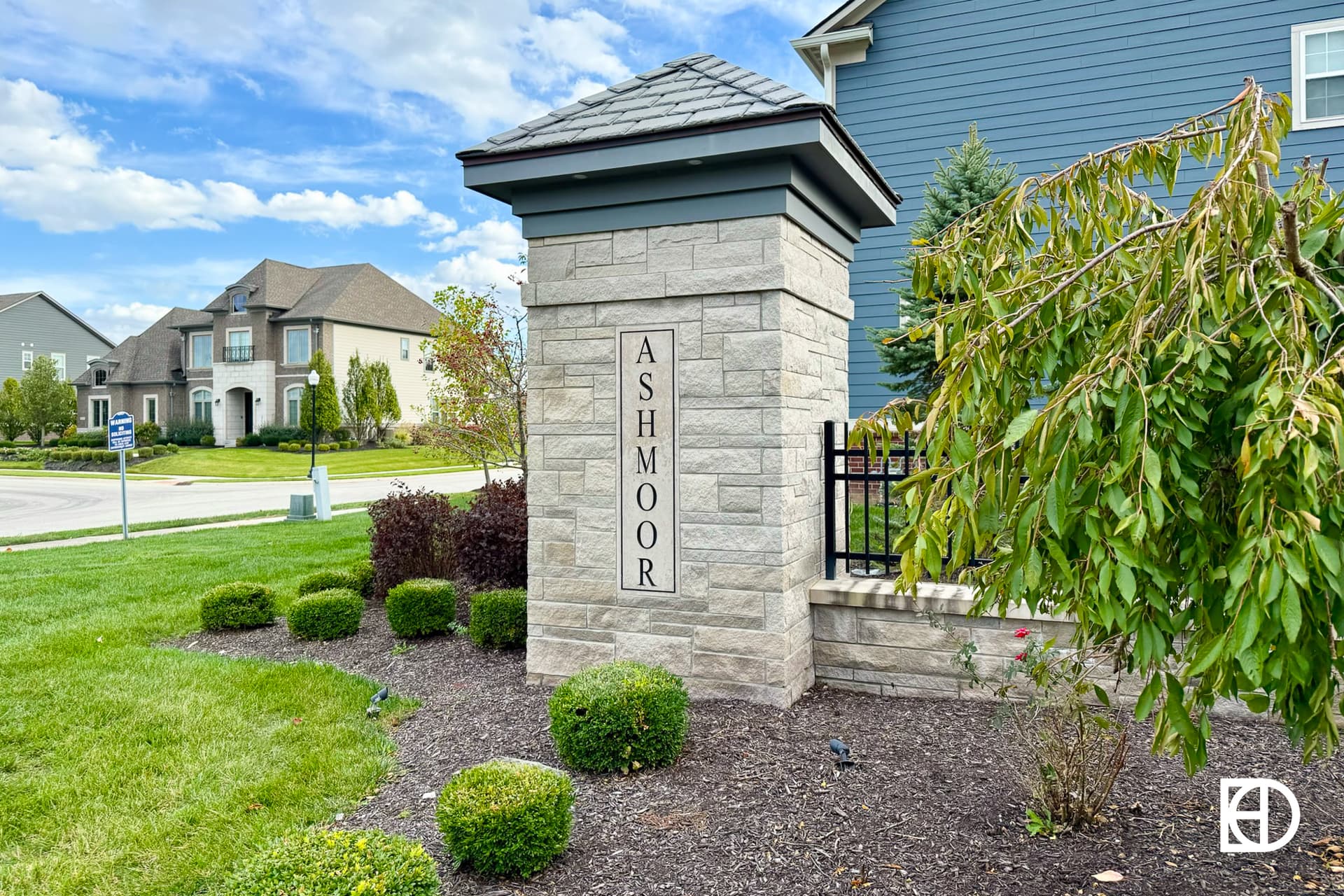 Exterior photo of Ashmoor, showing signage and landscaping
