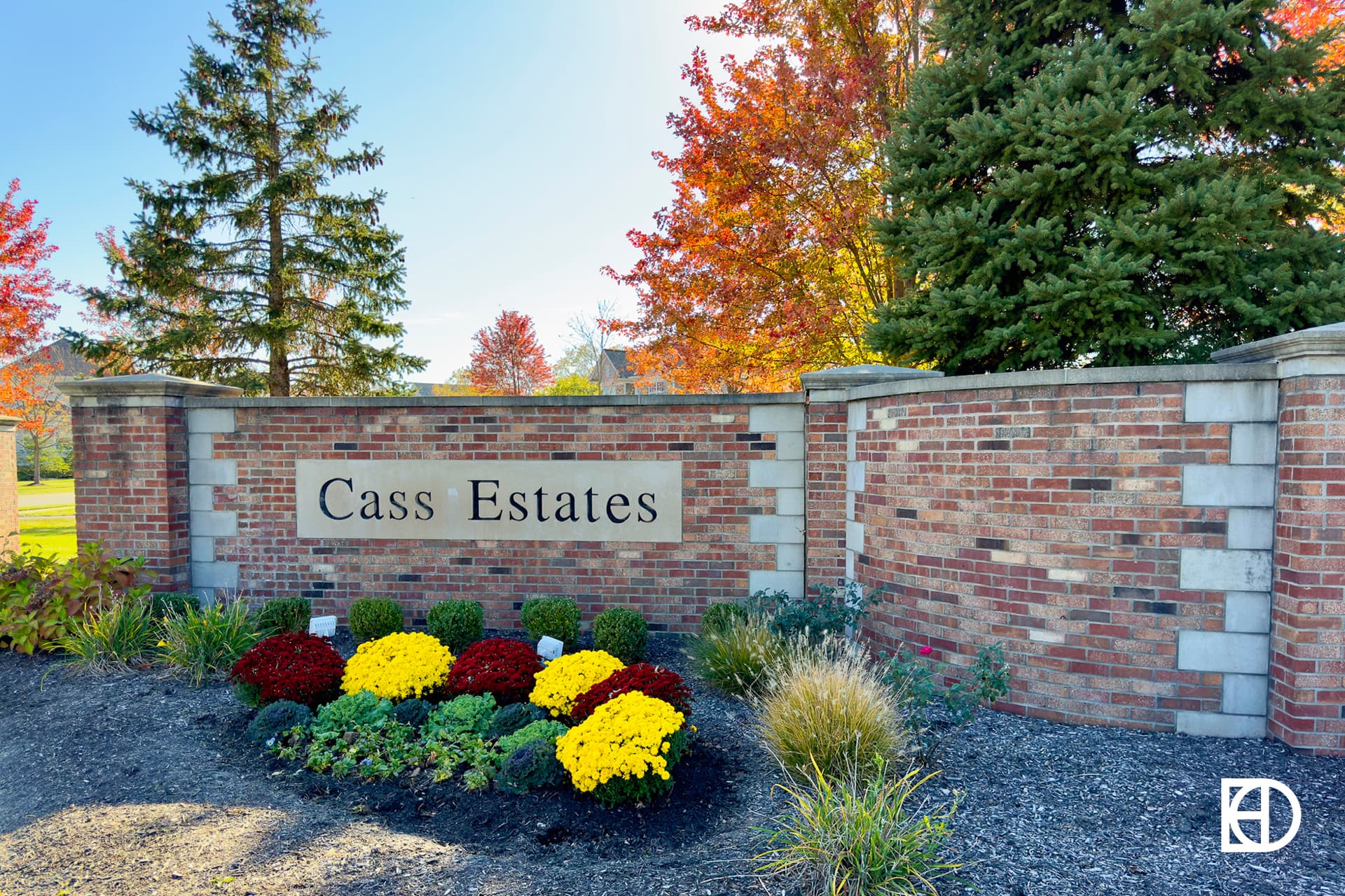 Exterior photo of Cass Estates, showing signage and landscaping