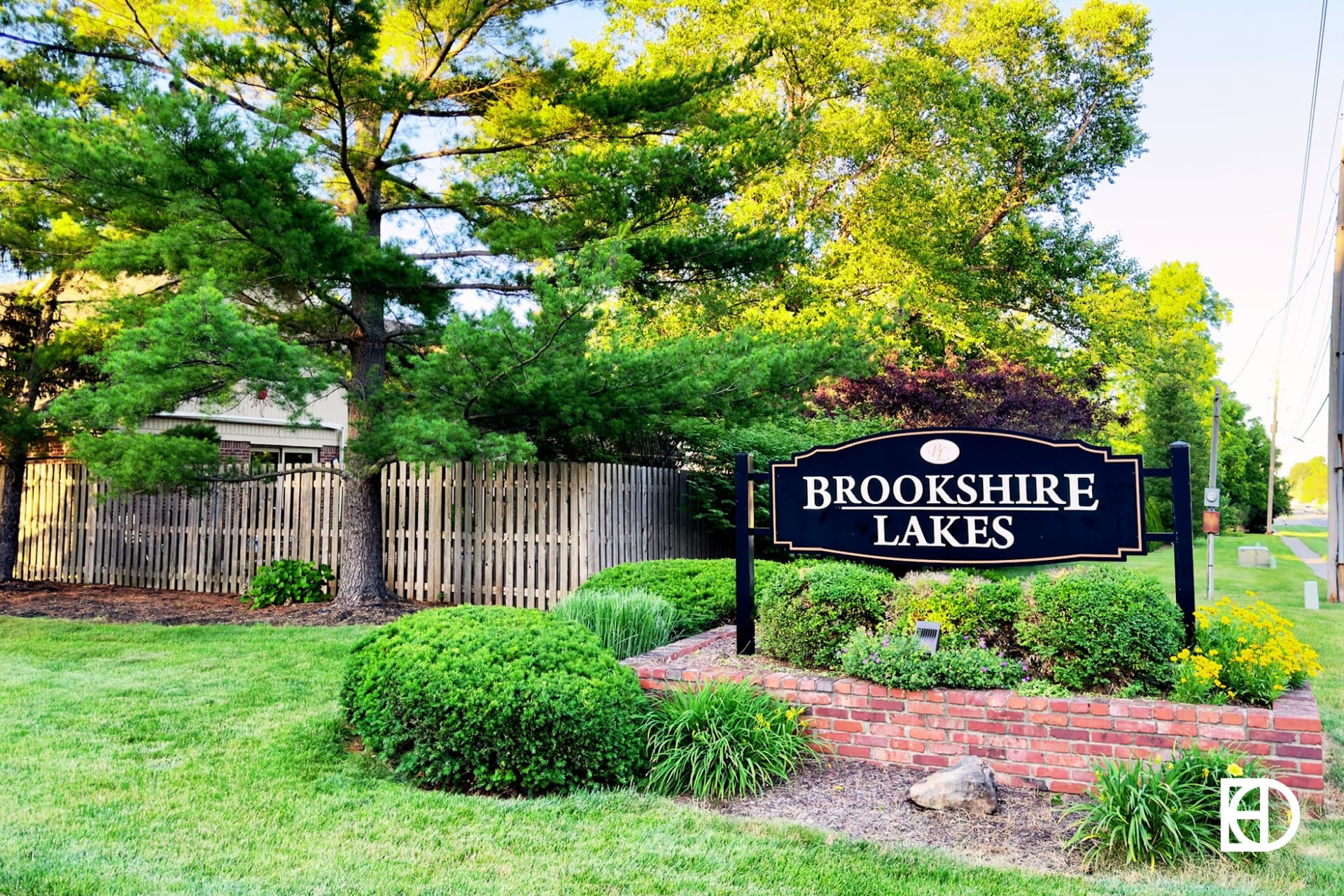 Exterior photo of Brookshire Lakes, showing signage and landscaping