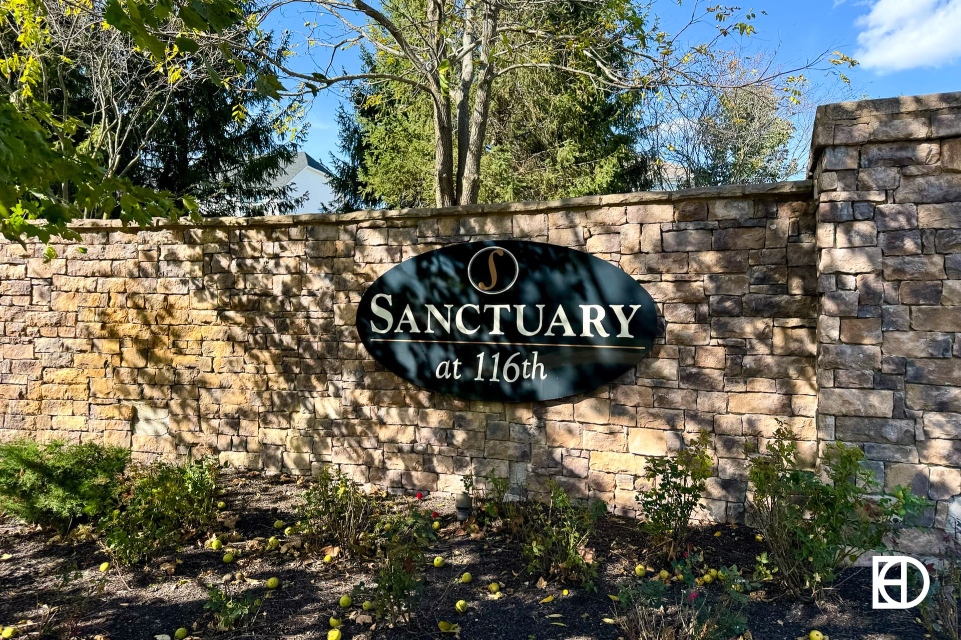 Exterior photo of Sanctuary, showing signage and landscaping