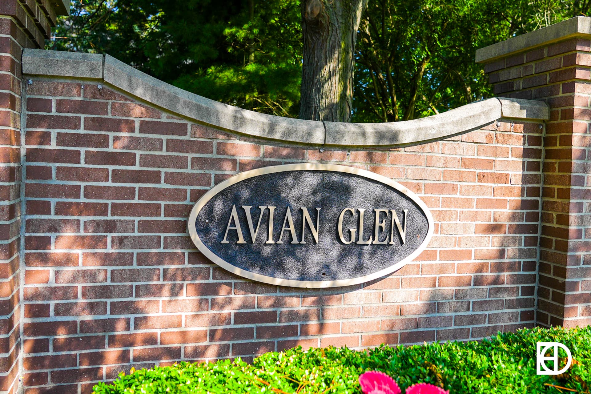 Exterior photo of Avian Glen, showing signage and landscaping