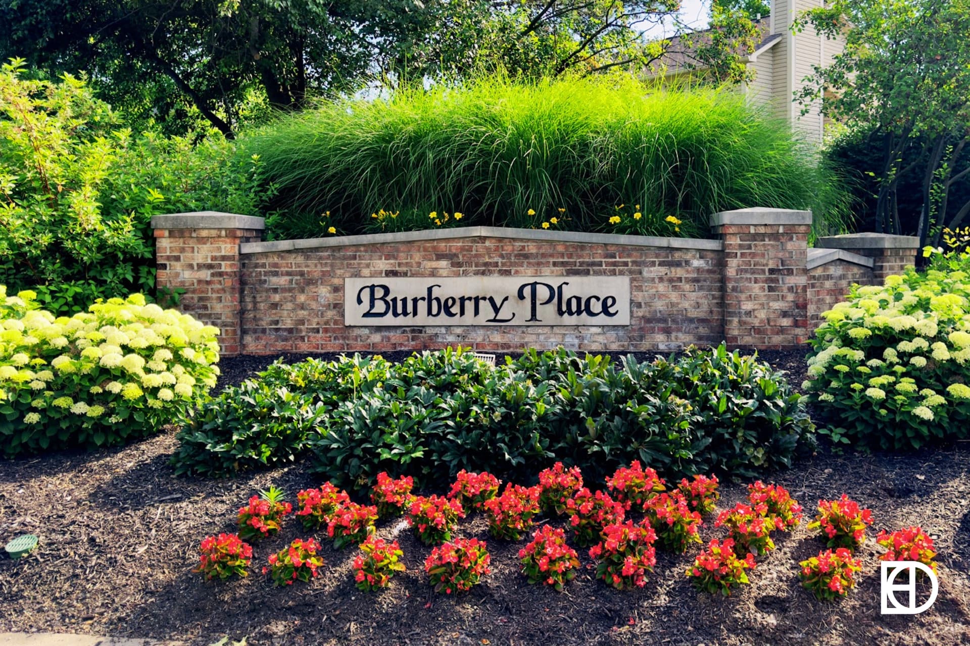 Exterior photo of Burberry Place, showing signage and landscaping
