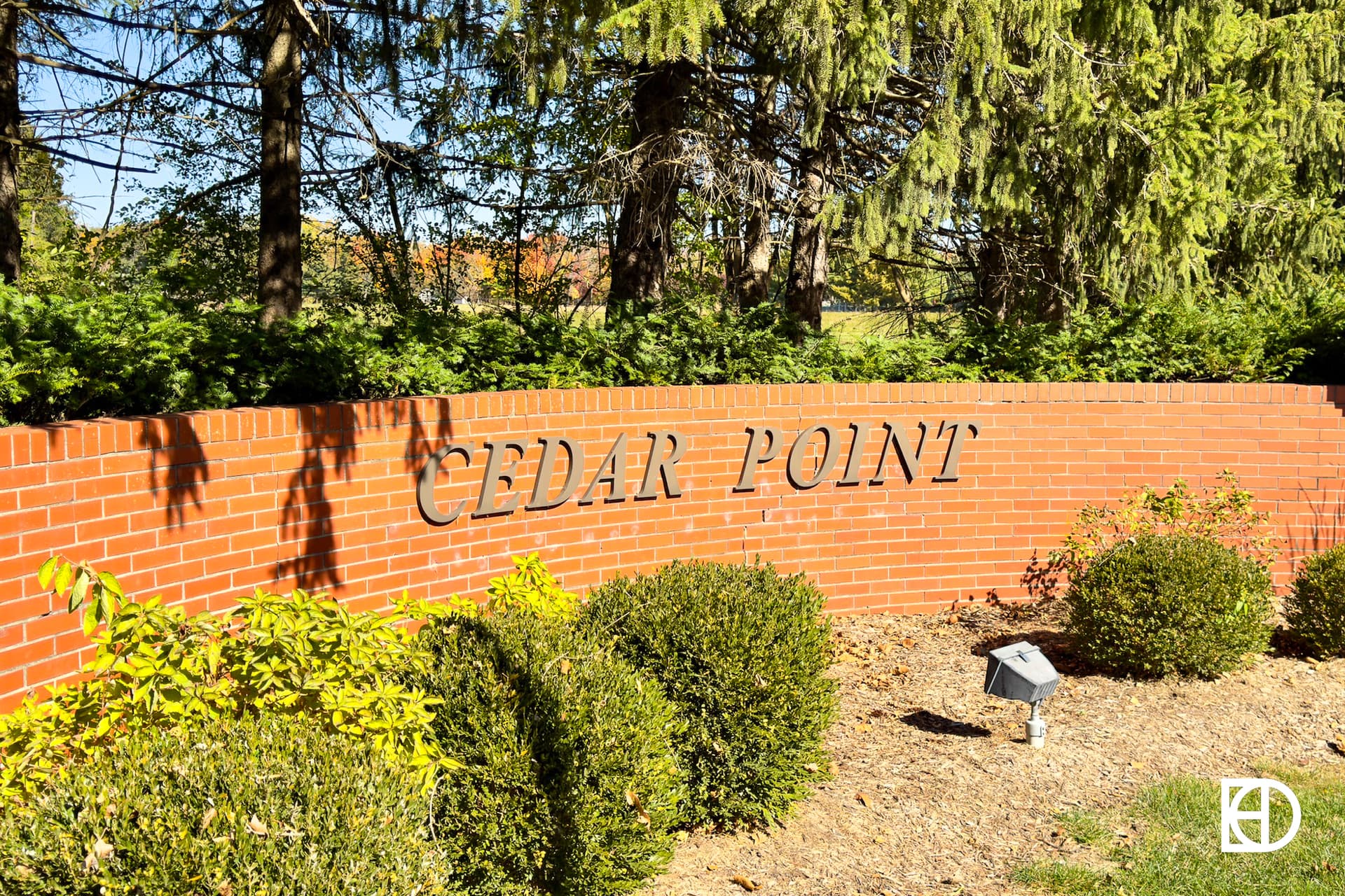 Exterior photo of Cedar Point, showing signage and landscaping