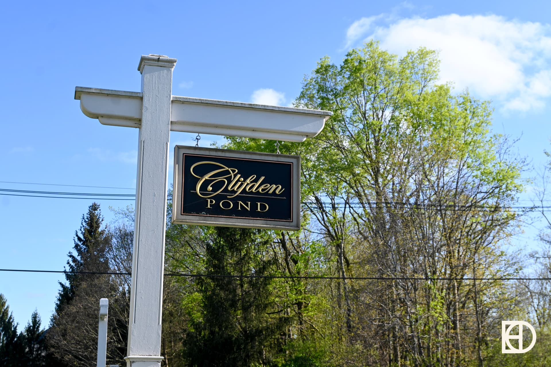 Exterior photo of Clifden Pond, showing signage and landscaping