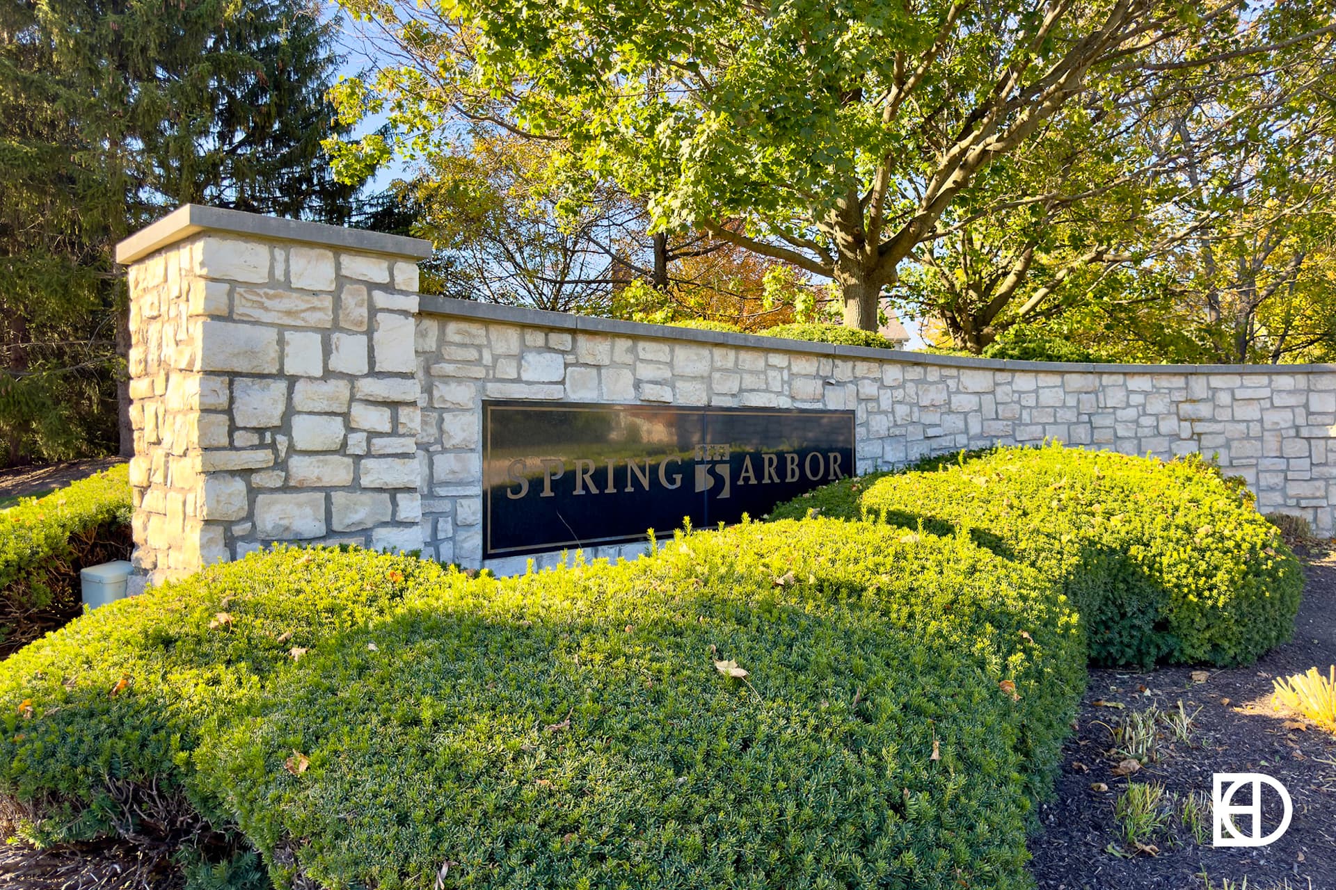 Exterior photo of Spring Arbor, showing signage and landscaping