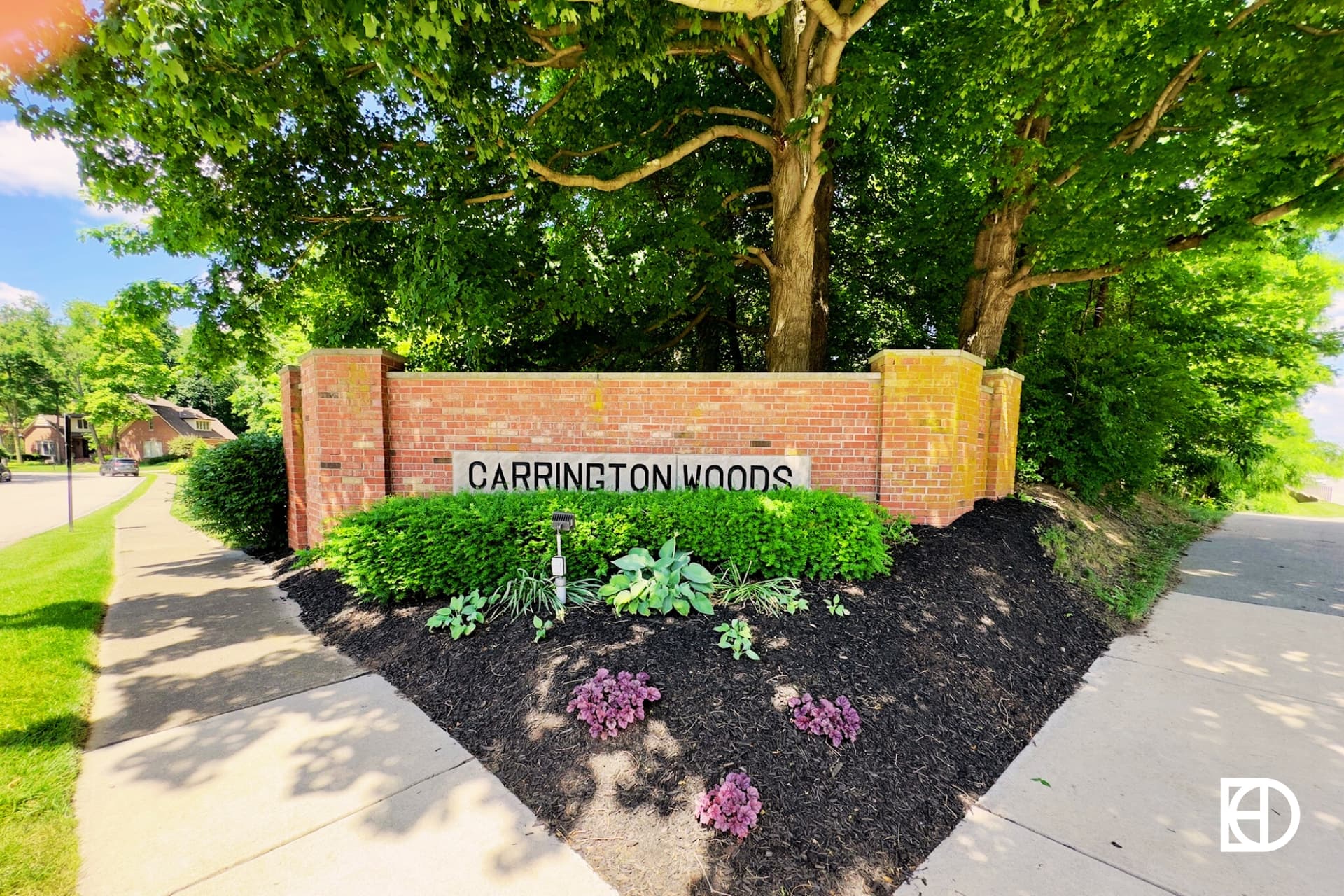 Exterior photo of Carrington Woods in East Carmel, showing signage and landscaping