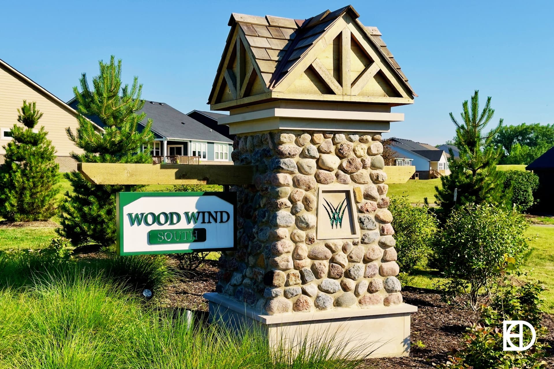 Exterior photo of Wood Wind South, showing signage and landscaping