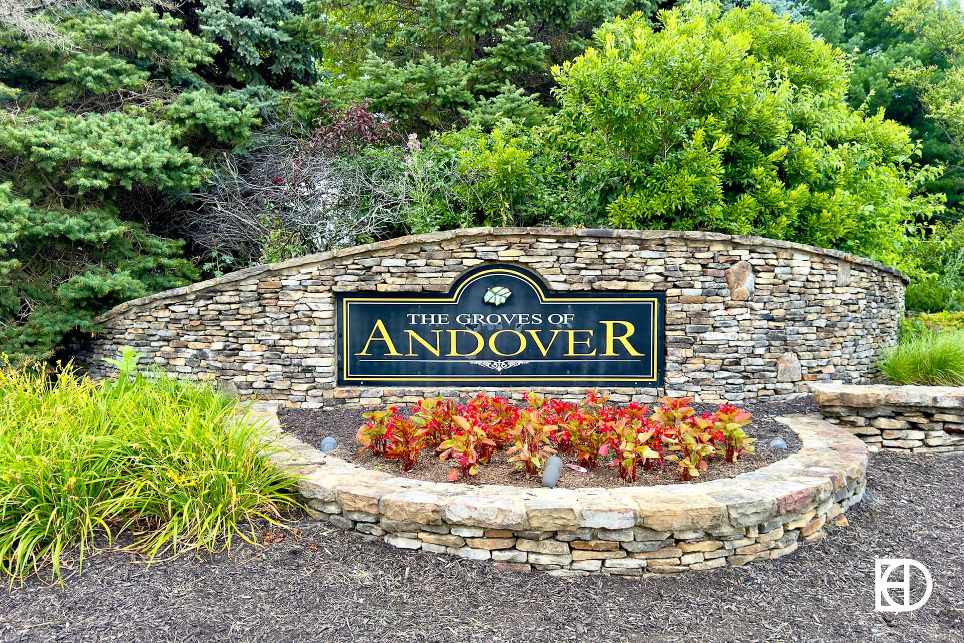 Exterior photo of the Groves of Andover, showing signage and landscaping