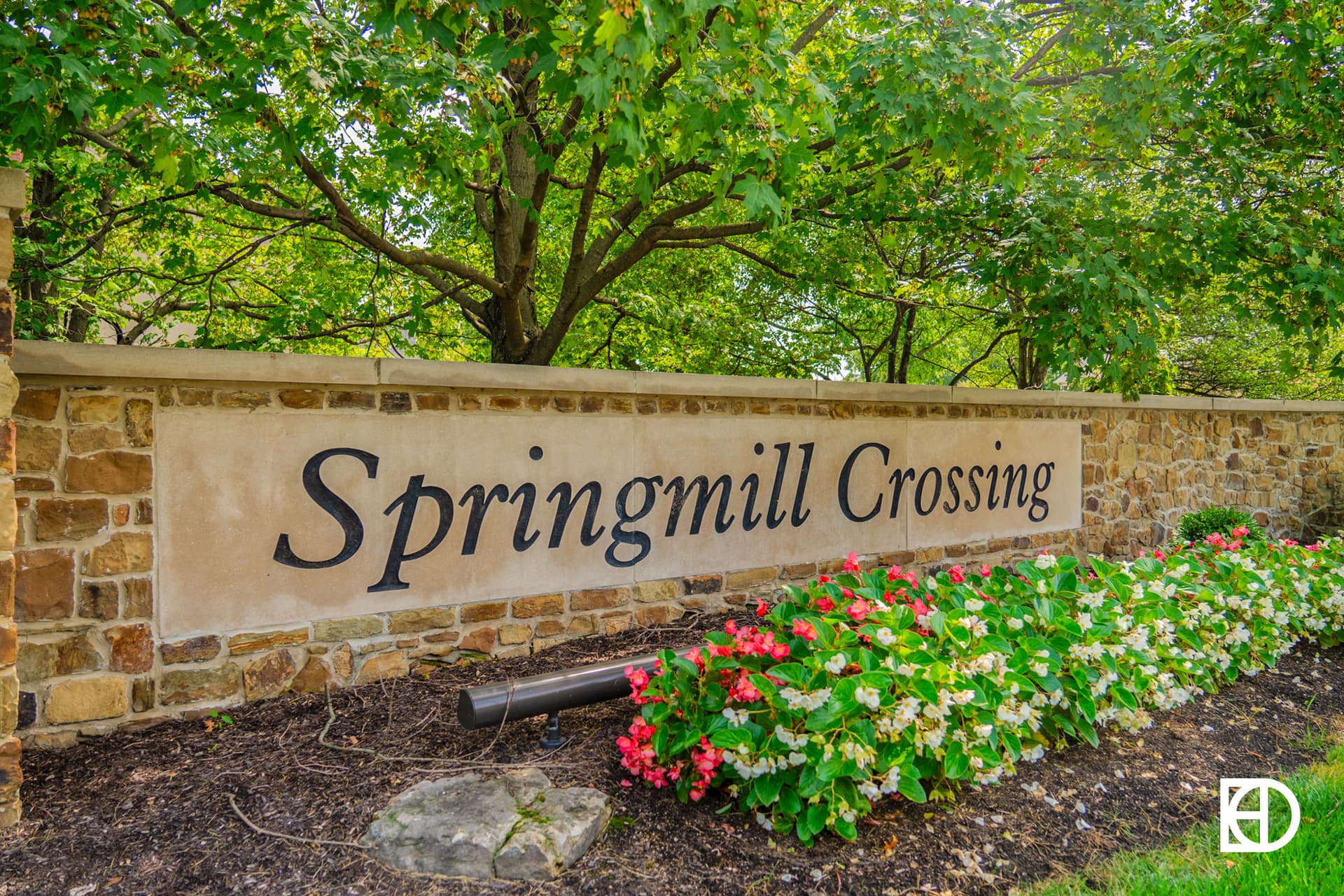 Exterior photo of Springmill Crossing, showing signage and landscaping