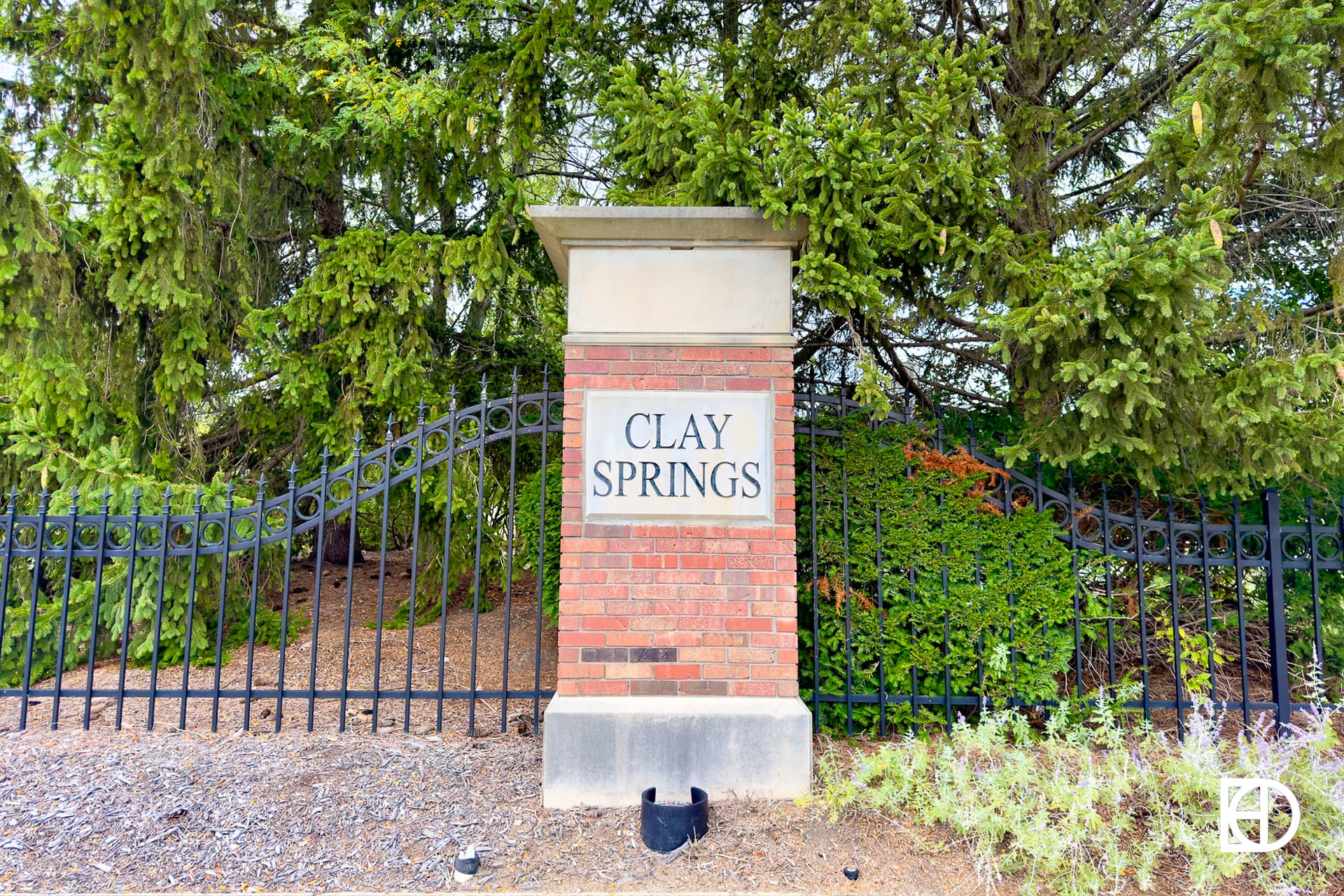 Exterior photo of Clay Springs, showing signage and landscaping