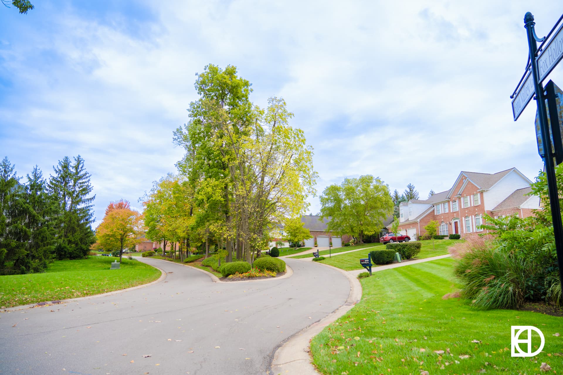 Photo of tree-lined street in Fox Hollow neighborhood in Zionsville, Indiana.