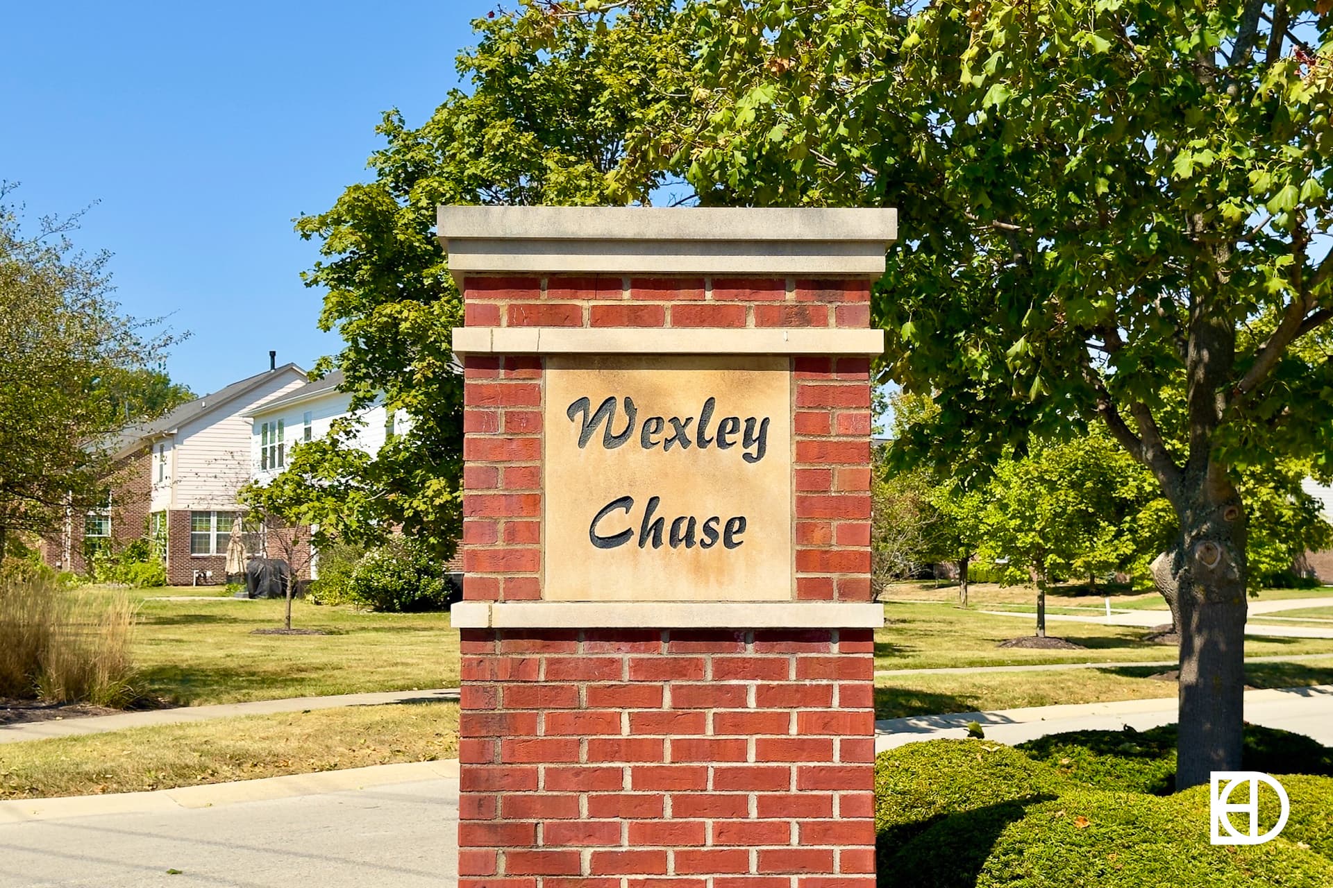 Exterior photo of Wexley Chase, showing signage and landscaping