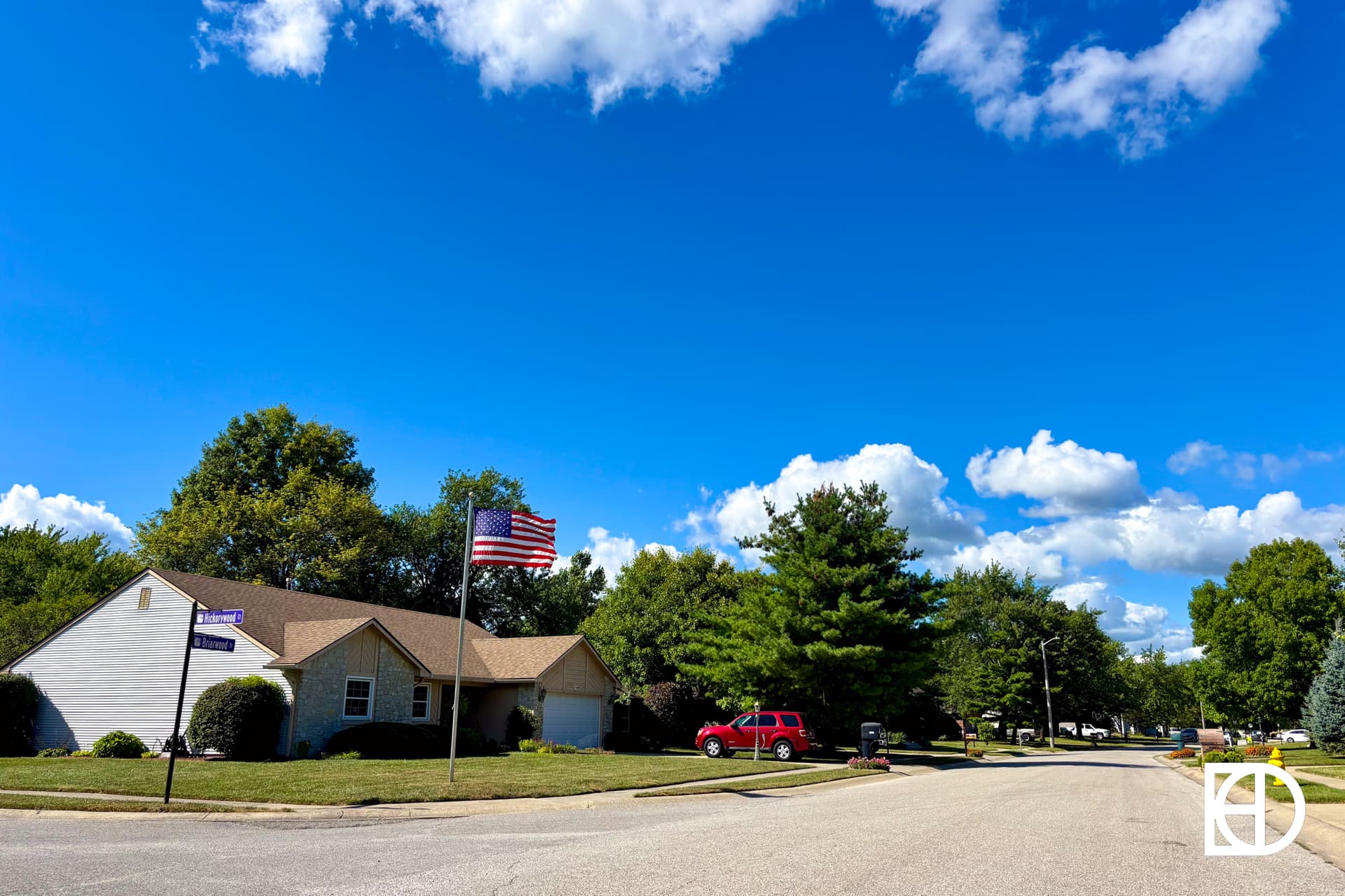 A house with a flag on the pole.