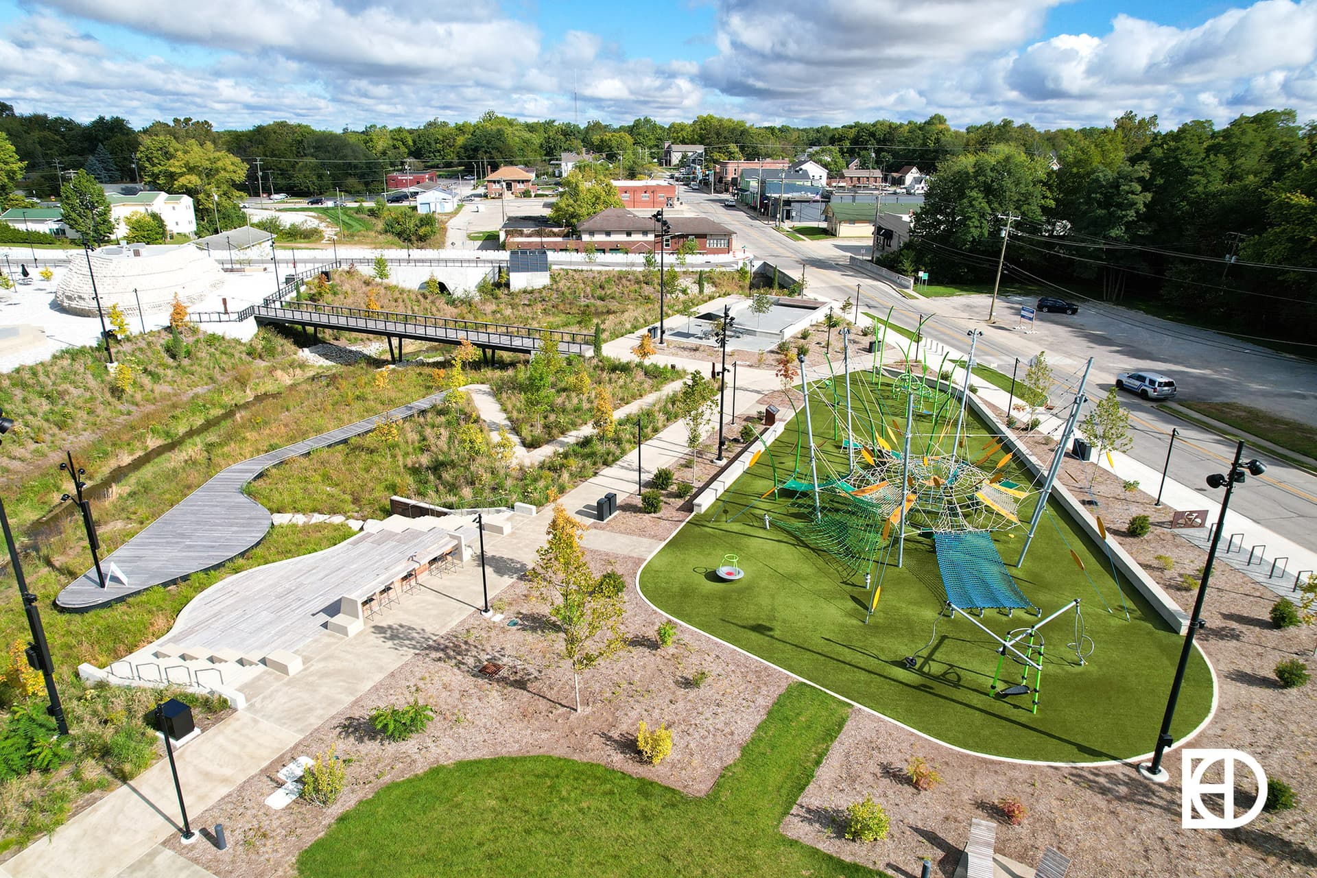 Aerial view of Grand Junction Plaza, showing playground, landscaping, and trees