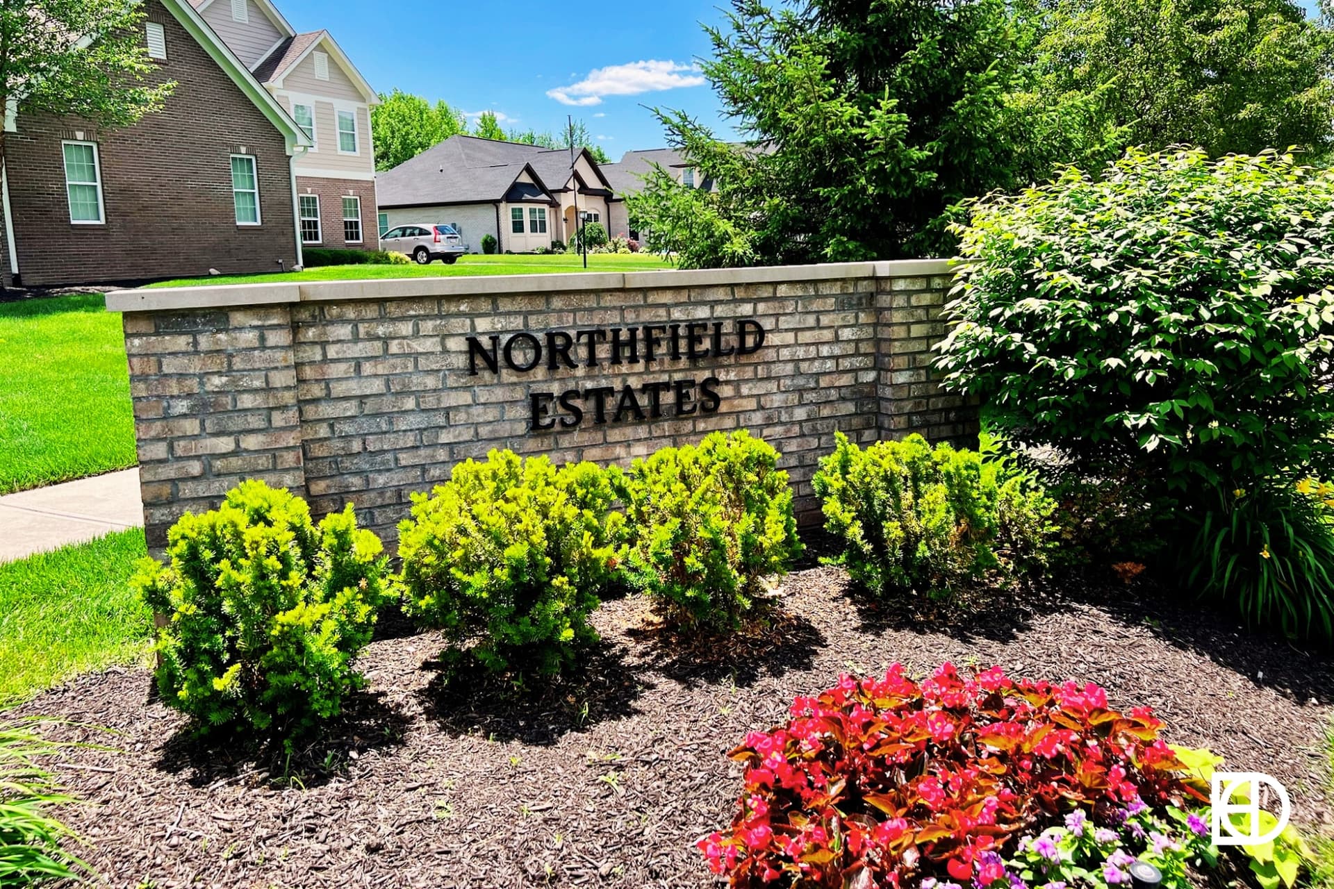 Exterior photo of Northfield Estates, showing signage and landscaping