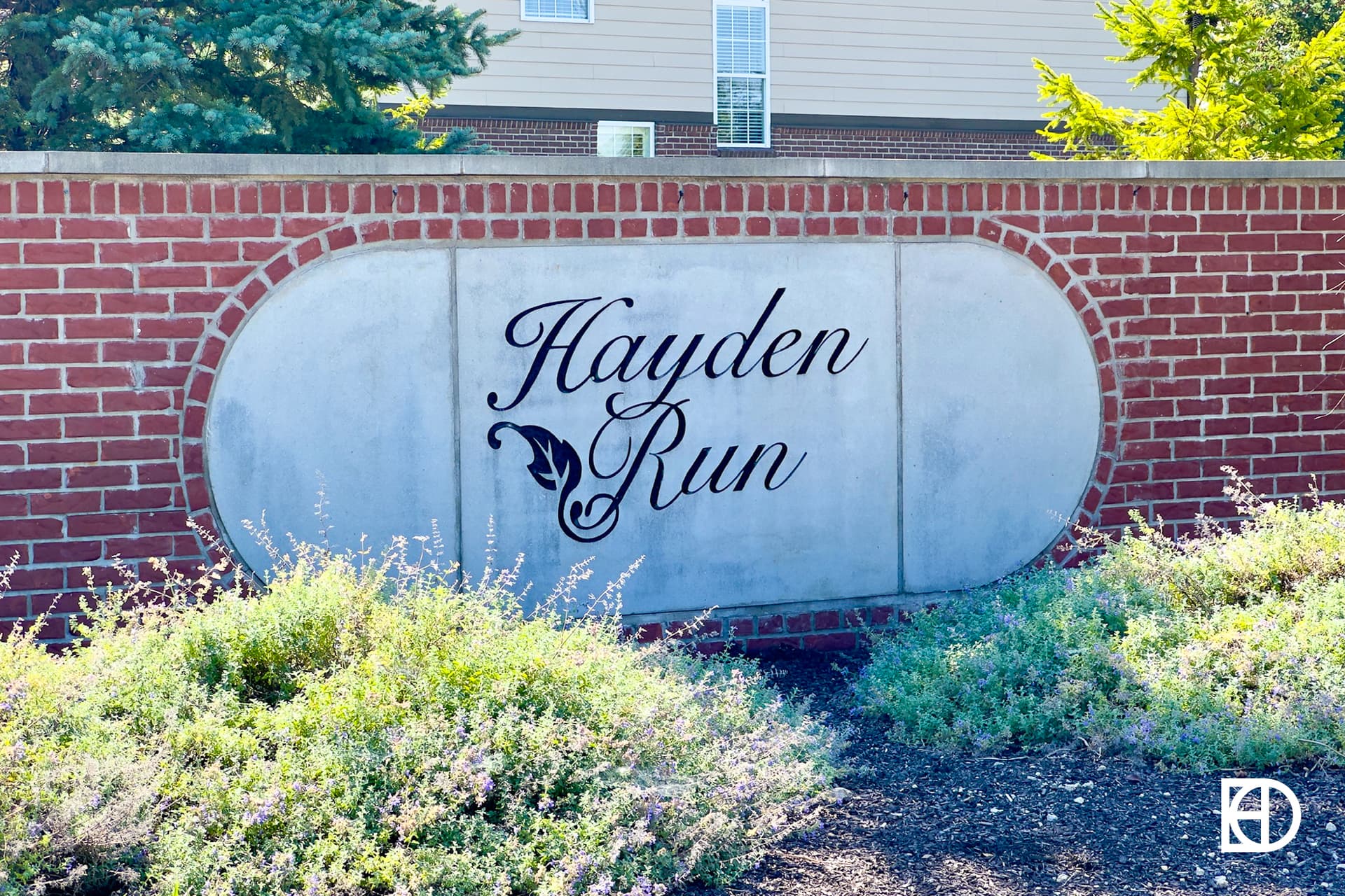 Exterior photo of Hayden Run, showing signage and landscaping