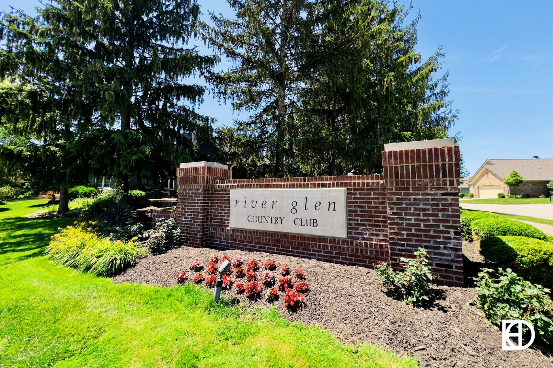Exterior photo of River Glen, showing signage and landscaping
