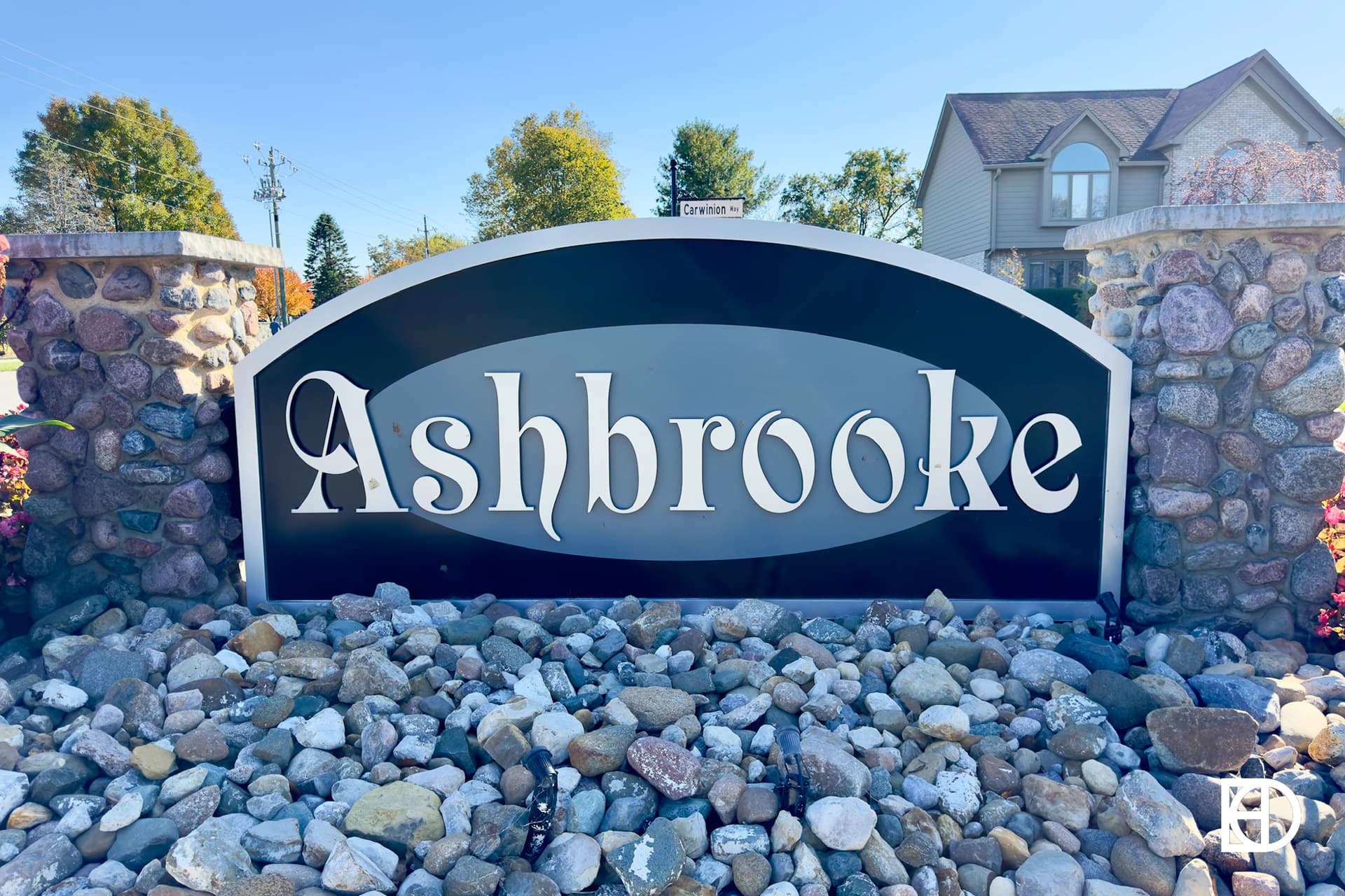 Exterior photo of Ashbrooke, showing signage and landscaping