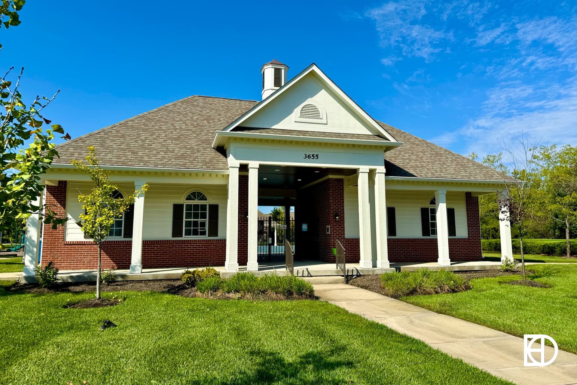 Exterior photo of Long Ridge Estates, showing clubhouse and landscaping