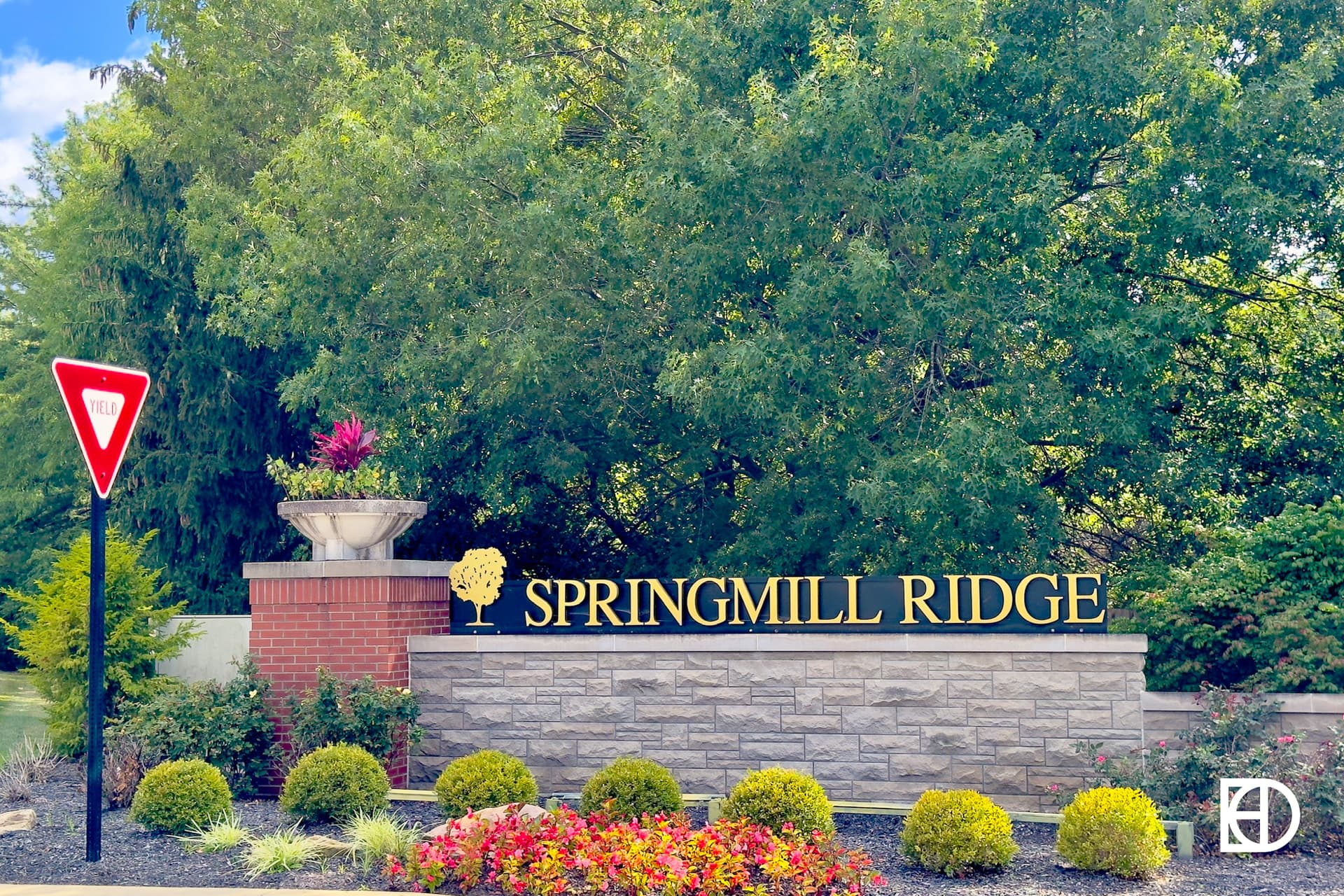 Exterior photo of Springmill Ridge, showing signage and landscaping