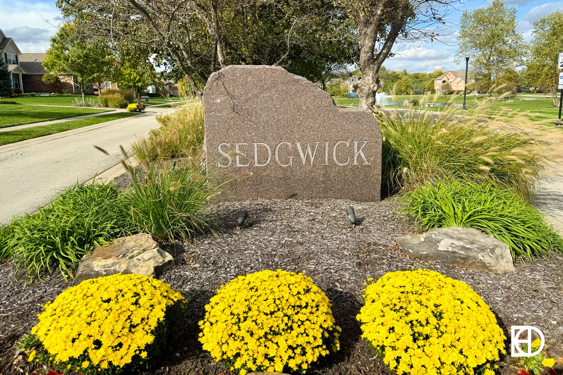 Exterior photo of Sedgewick, showing signage and landscaping