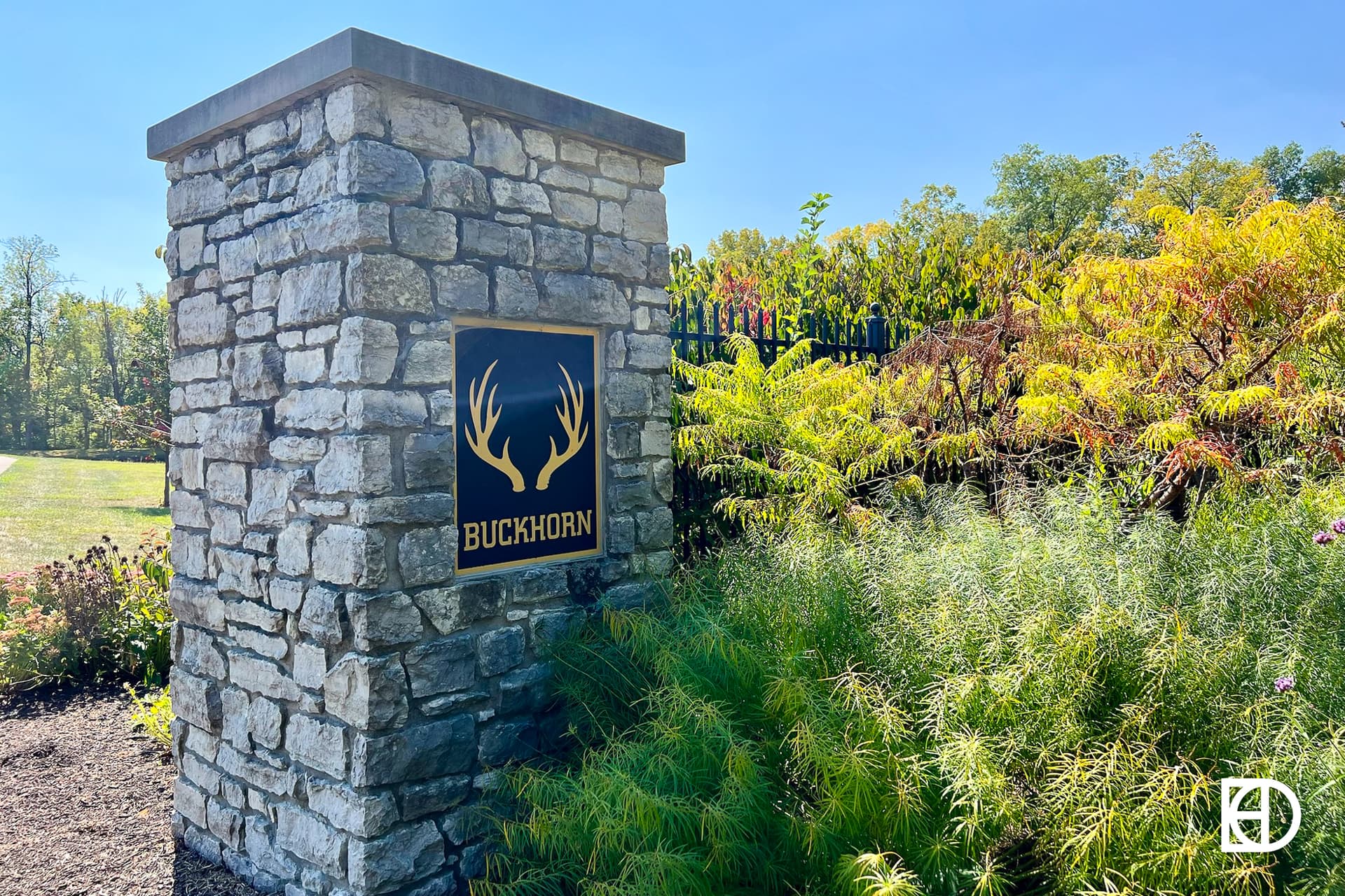 Exterior photo of Buckhorn Estates, showing signage and landscaping
