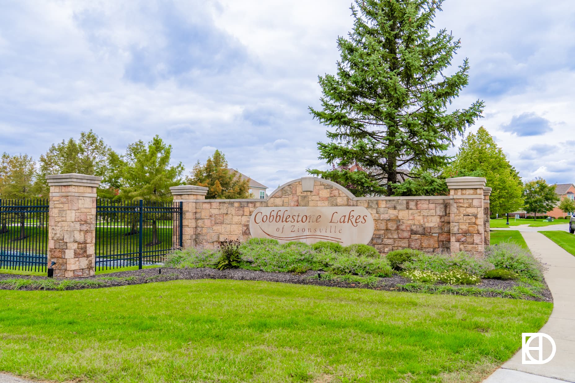 Photo of entrance sign for Cobblestone Lakes neighborhood in Zionsville, Indiana.