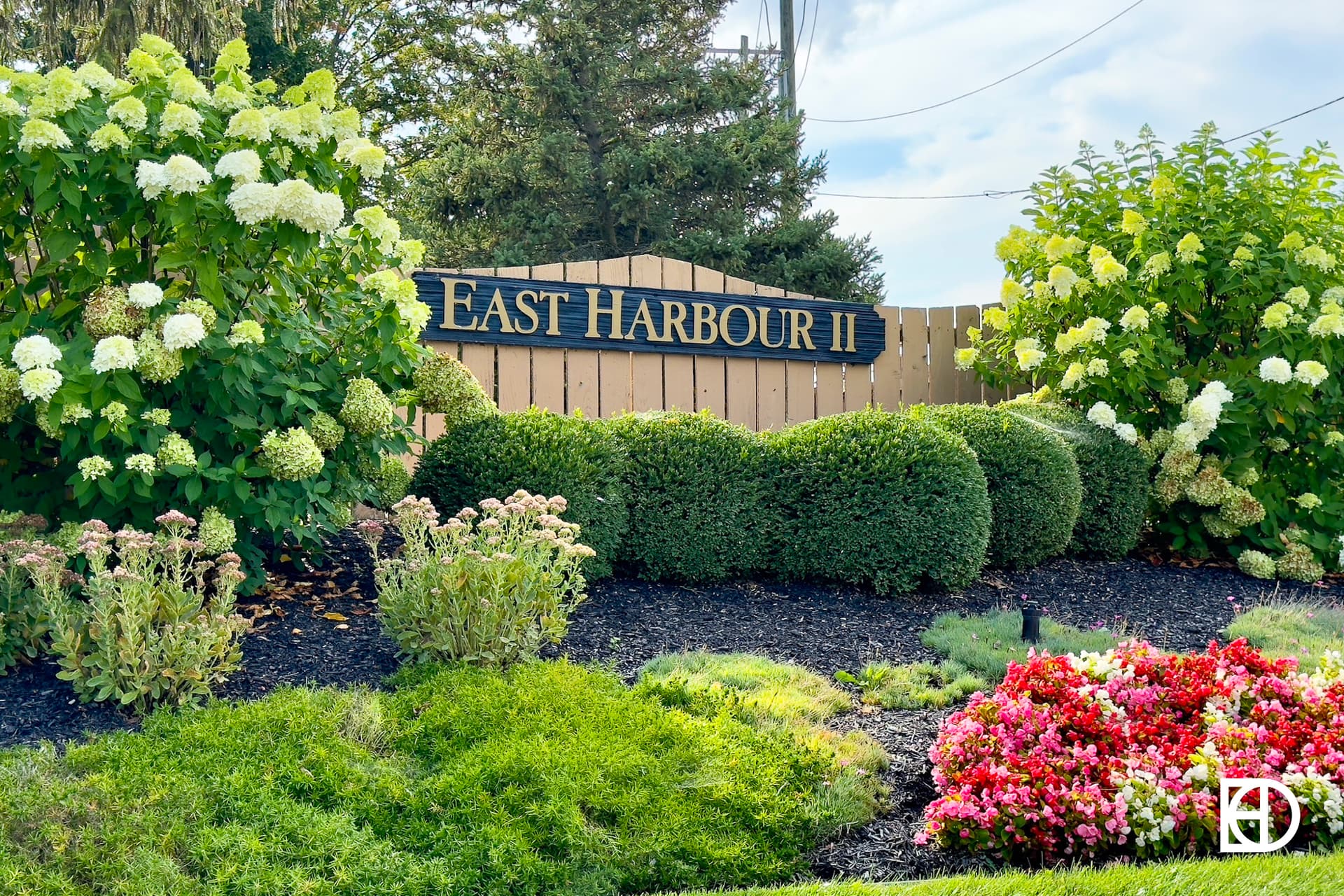 Exterior photo of East Harbour, showing signage and landscaping