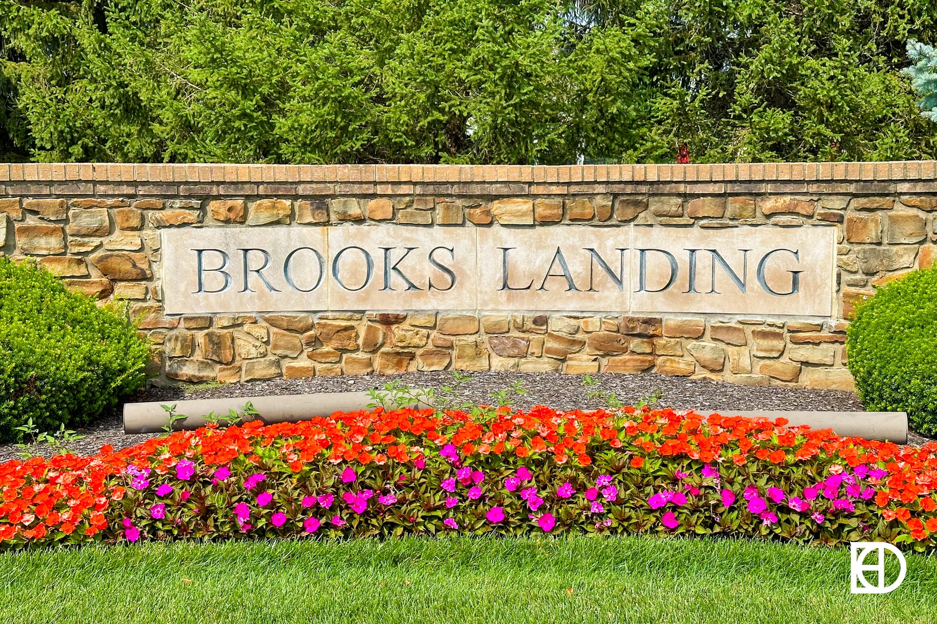 Exterior photo of Brooks Landing, showing signage and landscaping