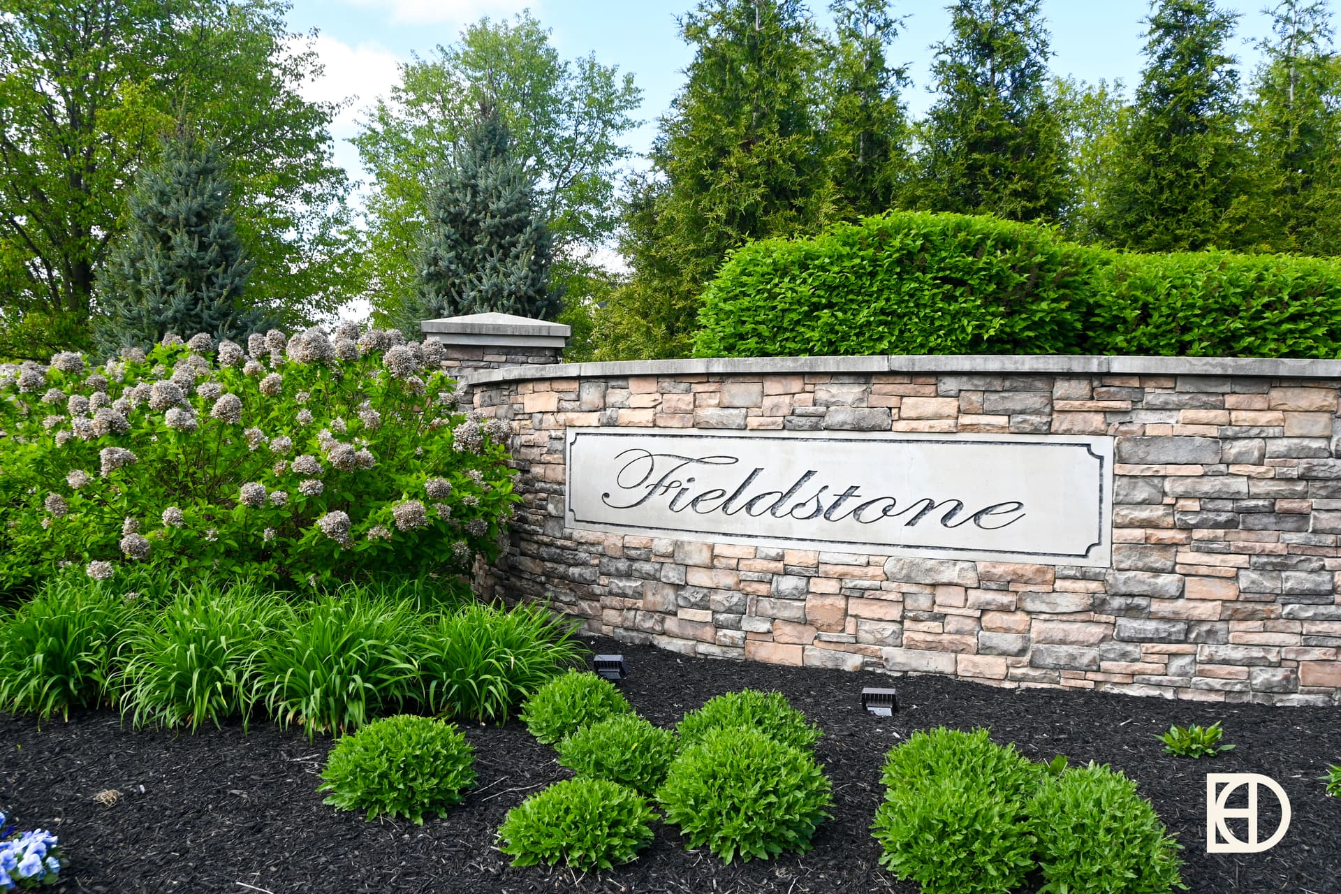 Exterior photo of Fieldstone, showing signage and landscaping