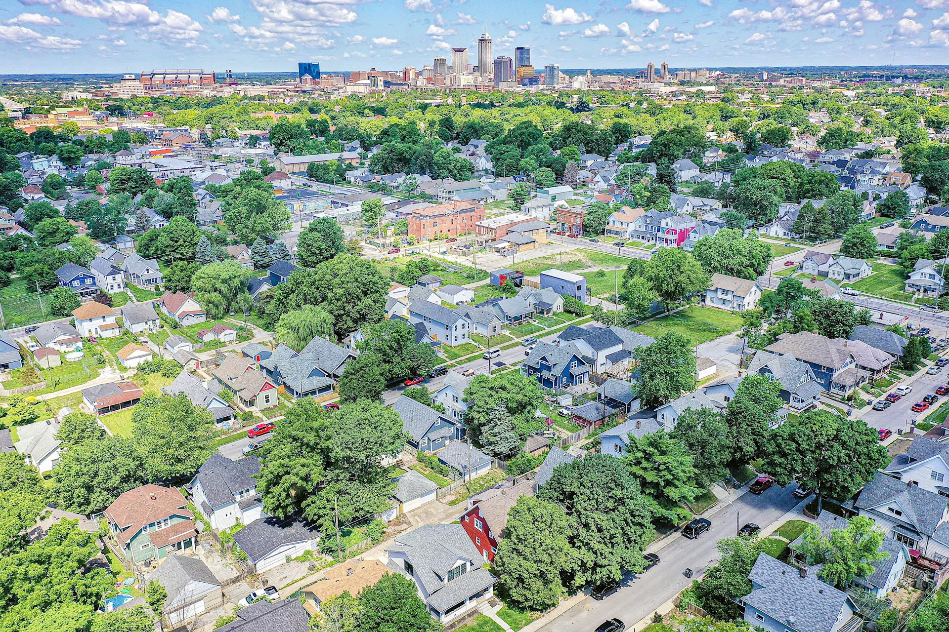Aerial photo of downtown Indianapolis neighborhood with skyline in the background