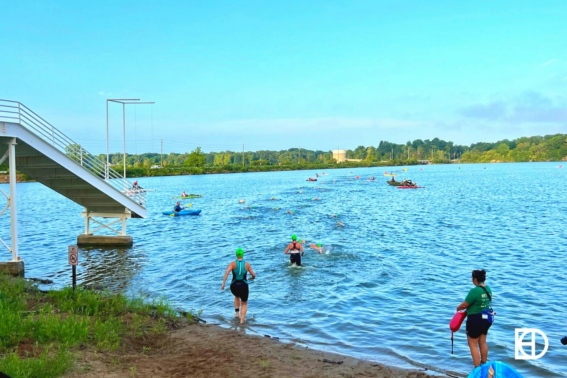 Exterior photo showing swimmers at the lake at Eagle Creek Park