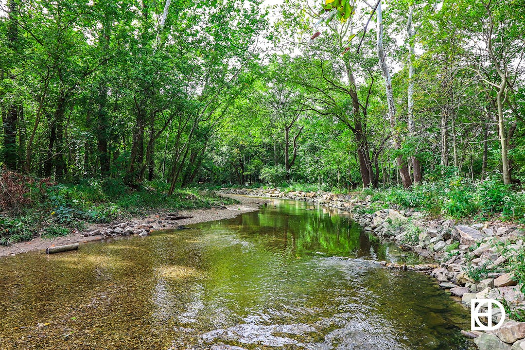 Photo of tree-lined Cool Creek in Flowing Well Park