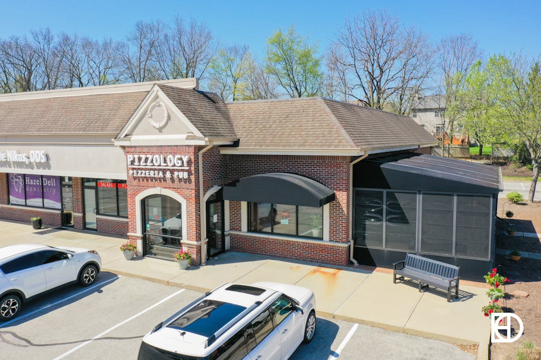 Aerial photo of Pizzology restaurant entrance.