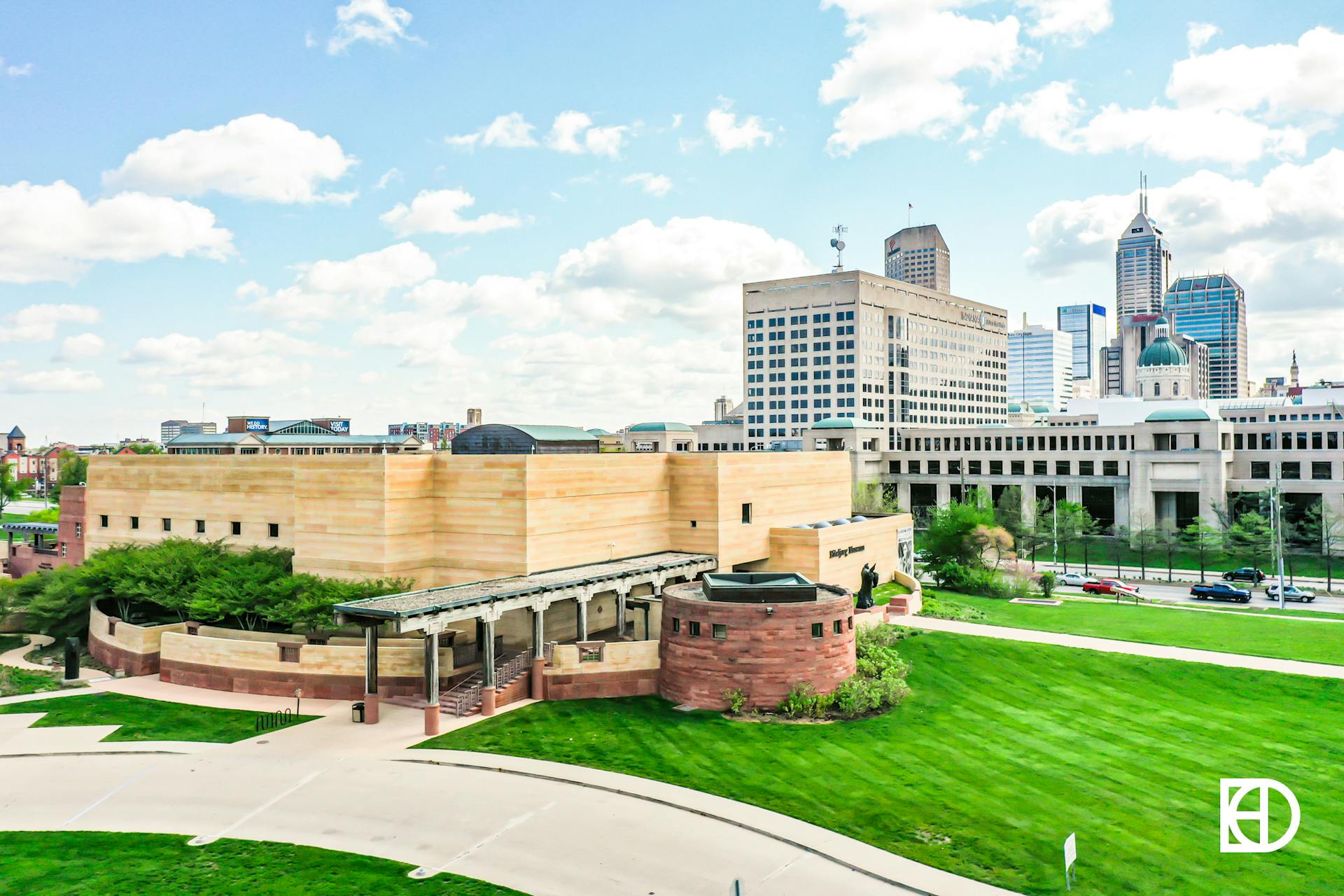 Aerial photo of Eiteljorg Museum building looking toward downtown Indianapolis skyline.